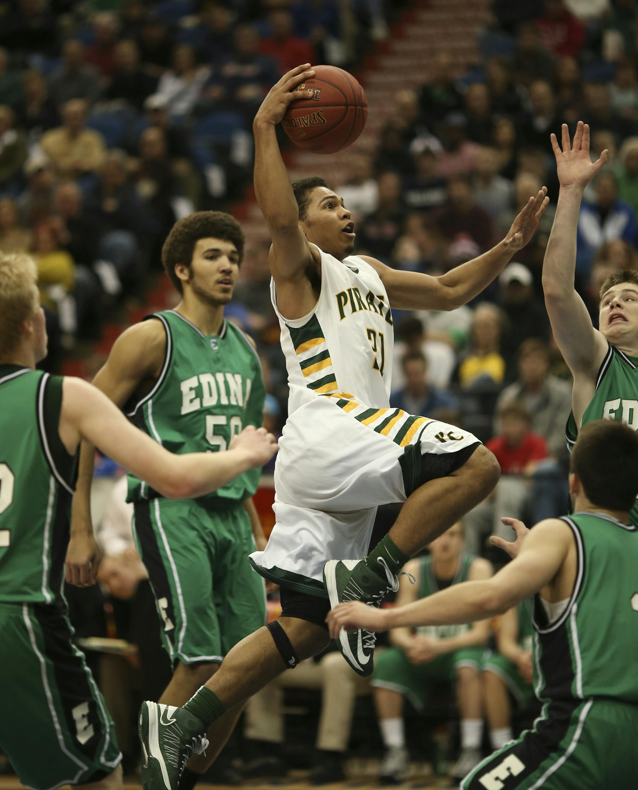 Park Center met Edina in a Class 4A Boys' Basketball State Tournament semifinal game Thursday night, March 21, 2013 at Target Center in Minneapolis. Park Center's Quinton Hooker drove through a swarm of Edina defenders to score two of his six first half points. ] JEFF WHEELER &#x201a;&#xc4;&#xa2; jeff.wheeler@startribune.com ORG XMIT: MIN1303212134180250