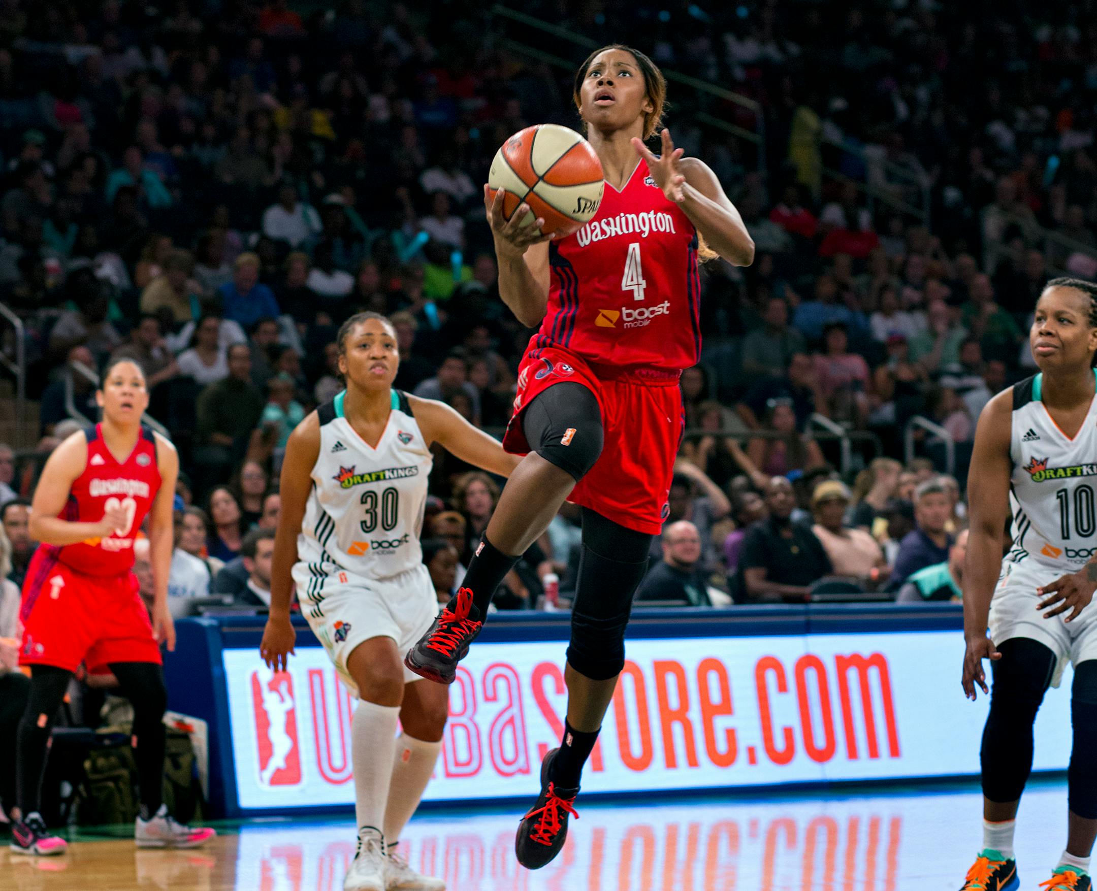 Washington Mystics' Tayler Hill goes up for two points as she drives past New York Liberty's LaToya Sanders (30) and Epiphanny Prince, right, in the second half of game one of a WNBA Eastern Conference basketball playoff series, Friday, Sept. 18, 2015 at Madison Square Garden in New York. (AP Photo/Craig Ruttle)