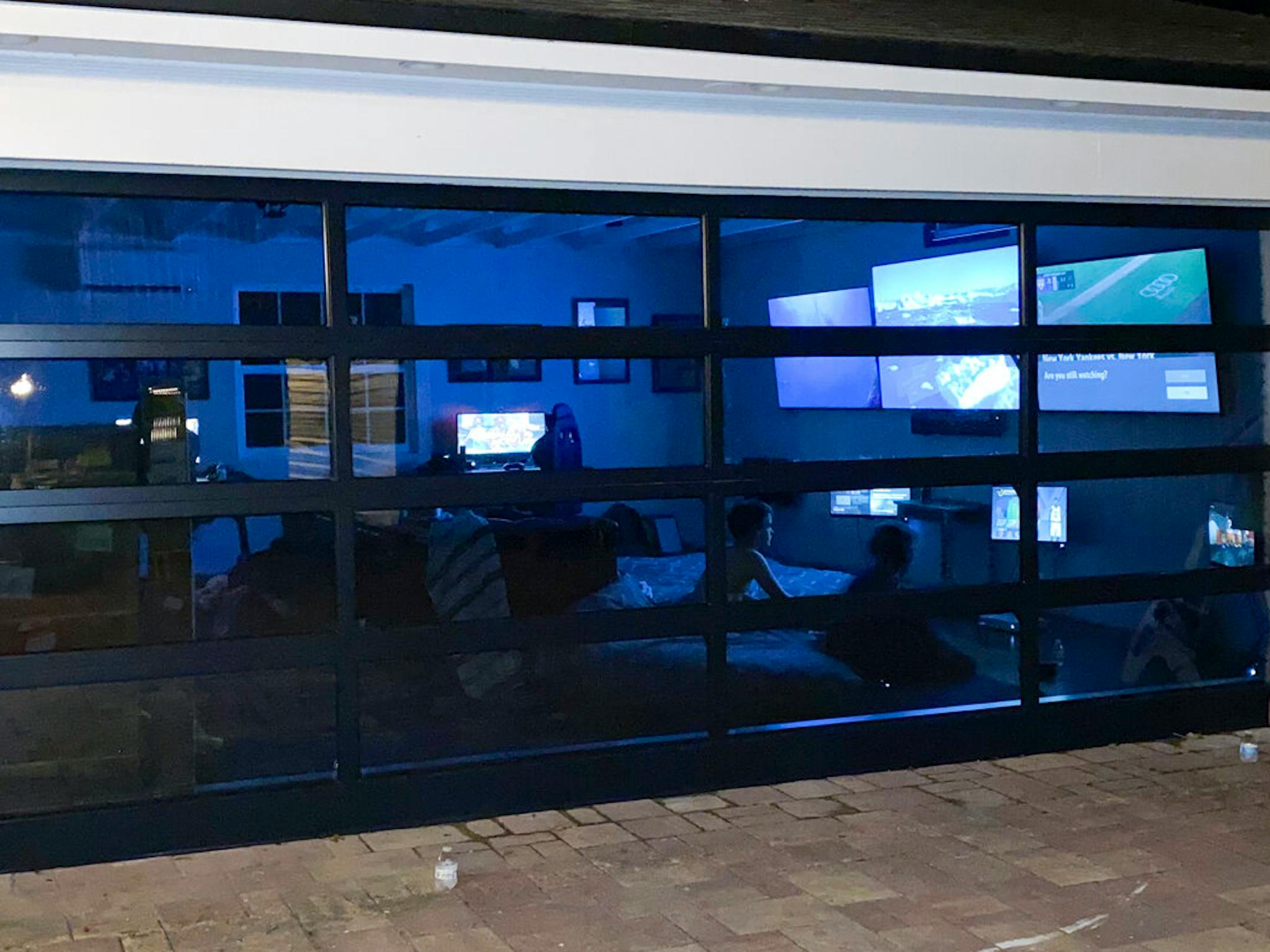 This image provided by Nick Nanton shows his converted garage in Orlando, Fla., Designers and architects say people are realizing what they do and don't need, and how familiar spaces can serve them better. We're repurposing the rooms we now spend so much time in. We're carving out separate spaces so family members can have alone time too. (Nick Nanton via AP)