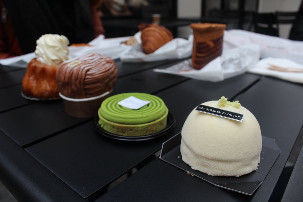 An array of pastries from Paris include a caramel mousse cake from pastry chef Claire Damon, at right.