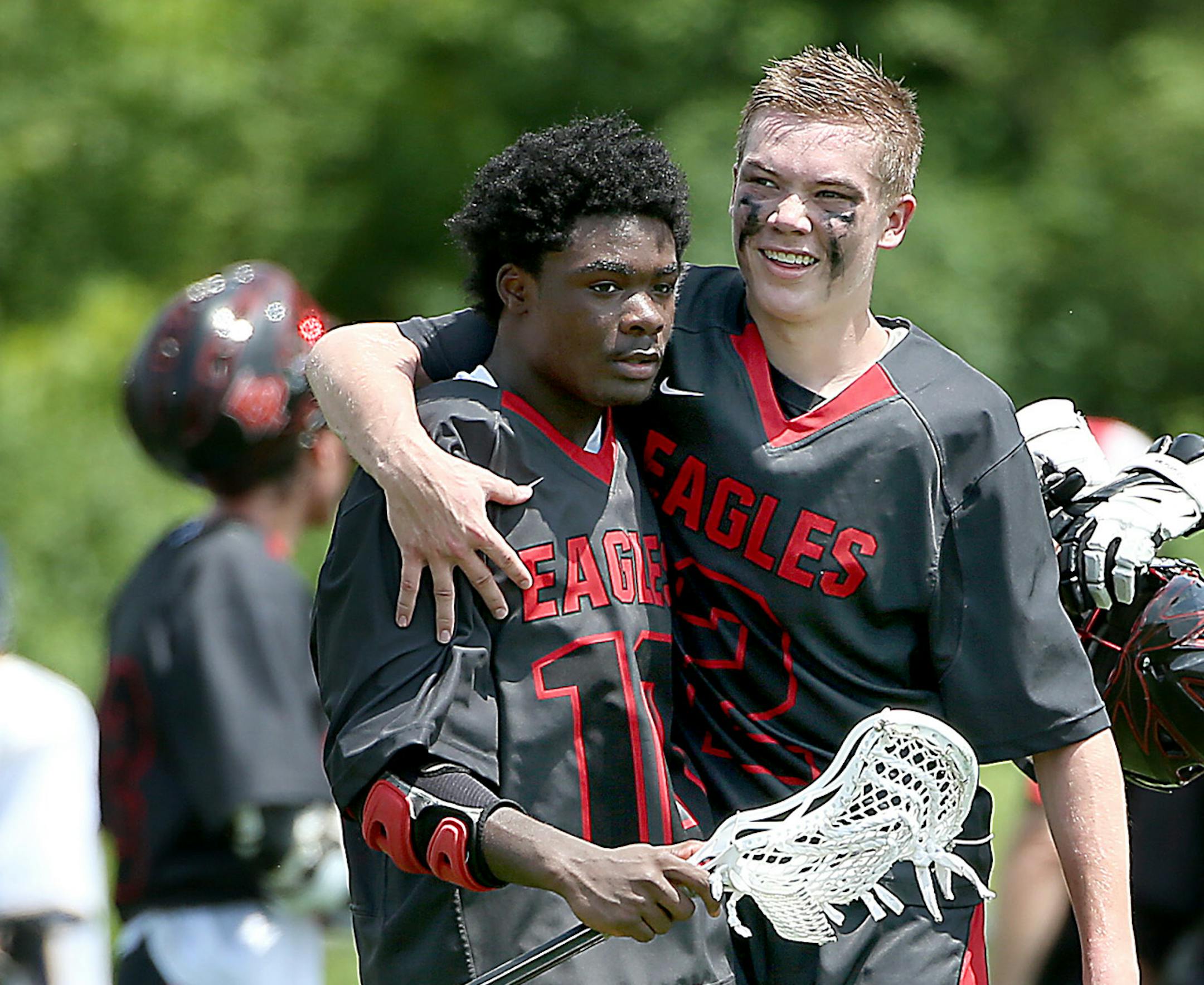 Eden Prairie's JD Spielmann, left, and Nick Leiverman celebrated their 13-11 victory over Rosemount after the boy's lacrosse Championship game at Rosemount High School, Tuesday, June 17, 2014. ] (ELIZABETH FLORES/STAR TRIBUNE) ELIZABETH FLORES • eflores@startribune.com ORG XMIT: MIN1406171457330092