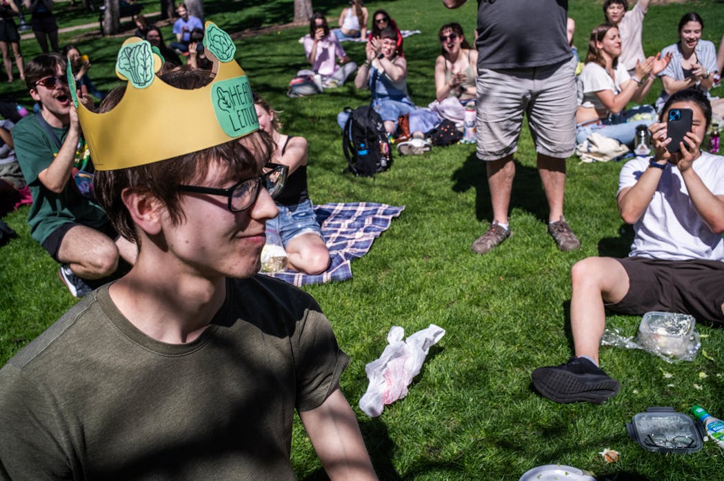 Sophomore Nathan Thomas who ate a head of lettuce in five minutes and 21 seconds is crowned Head of Lettuce on the University of Minnesota campus in Minneapolis on Sunday.