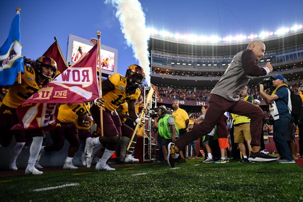 The Minnesota Gophers were led out to the field by Minnesota Gophers head coach PJ Fleck before Thursday night's game against the South Dakota State J