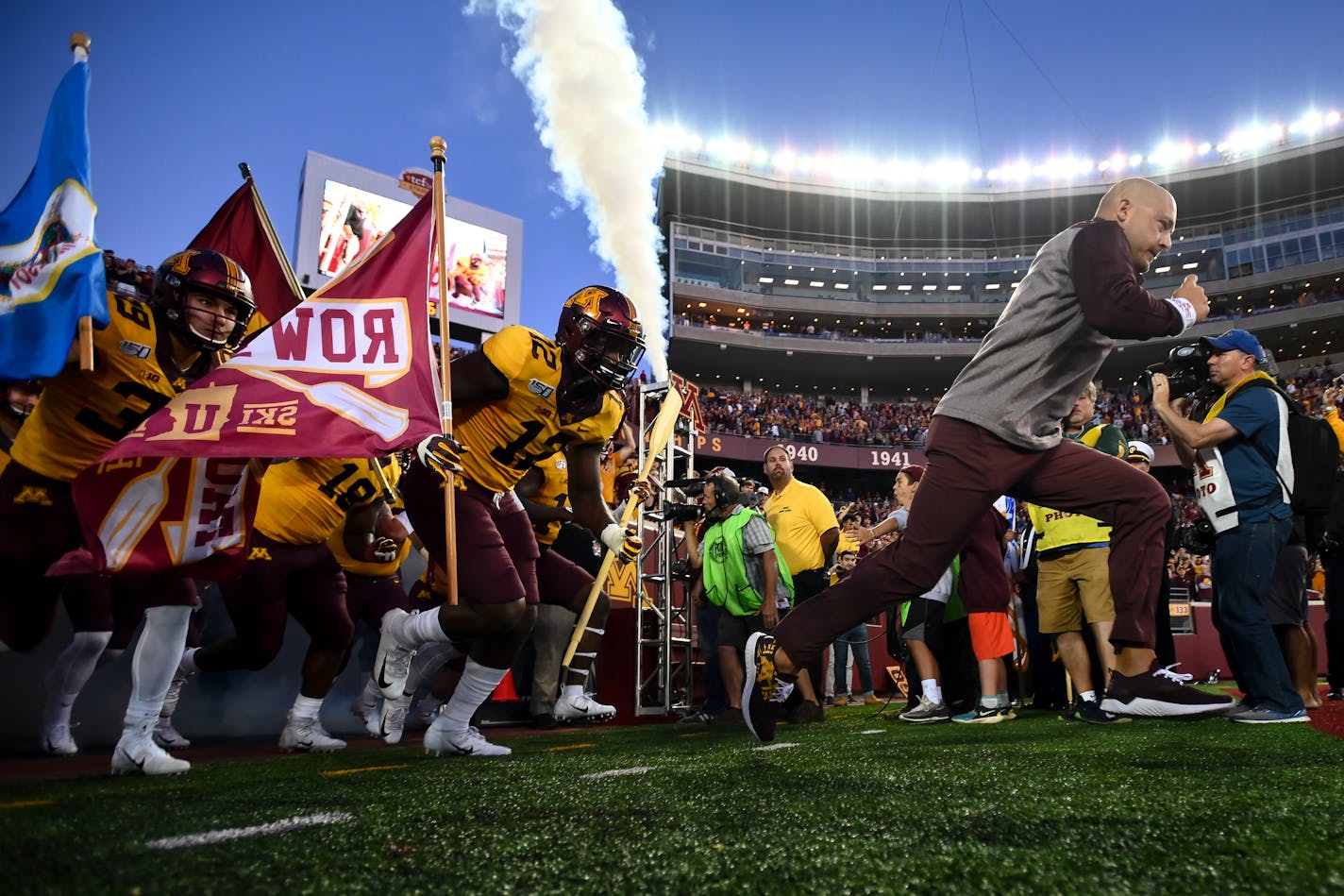 The Minnesota Gophers were led out to the field by Minnesota Gophers head coach PJ Fleck before Thursday night's game against the South Dakota State Jackrabbits.