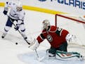 Wild goalie Devan Dubnyk deflected a shot in front of Lightning left winger Ondrej Palat during the first period Saturday.