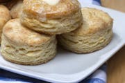 The buttermilk in these biscuits serves as the acid necessary to activate the baking soda in the ingredients. The liquid also adds extra flavor and he