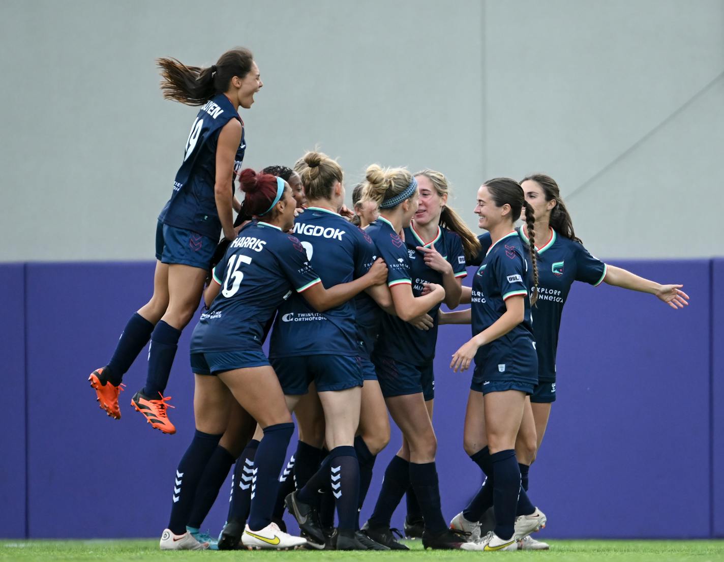 Teammates celebrate with Minnesota Aurora forward Catherine Rapp after she scored a goal against Rochester FC on May 24