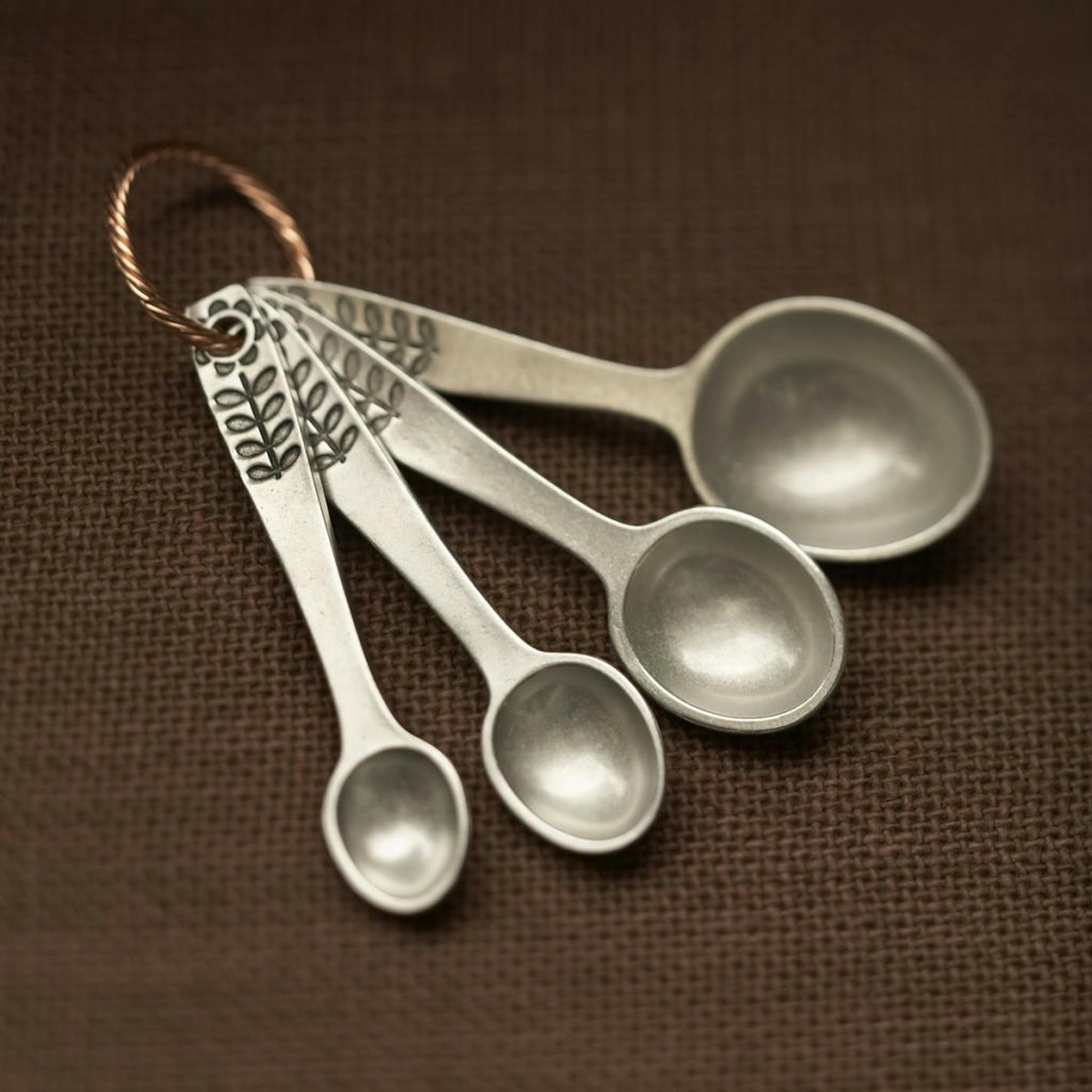 The measuring spoons from Beehive Kitchenware Co.are available in a variety of patterns.