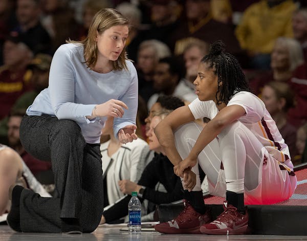Gophers head coach Lindsay Whalen spoke with Kenisha Bell during a game vs. Rutgers earlier this month.