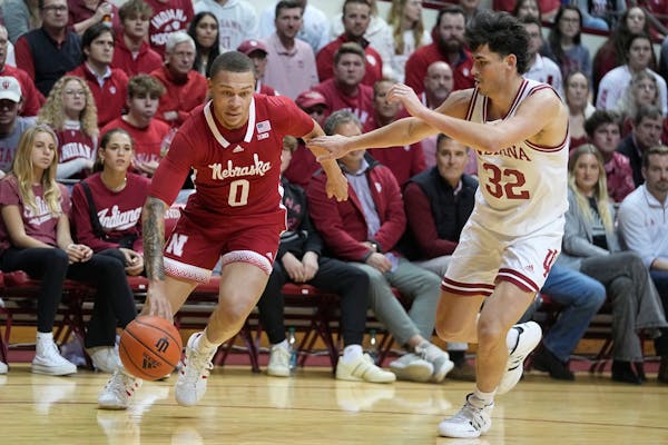 Nebraska's C.J. Wilcher (0) drives against Indiana's Trey Galloway (32) during the first half of an NCAA college basketball game Wednesday, Dec. 7, 20