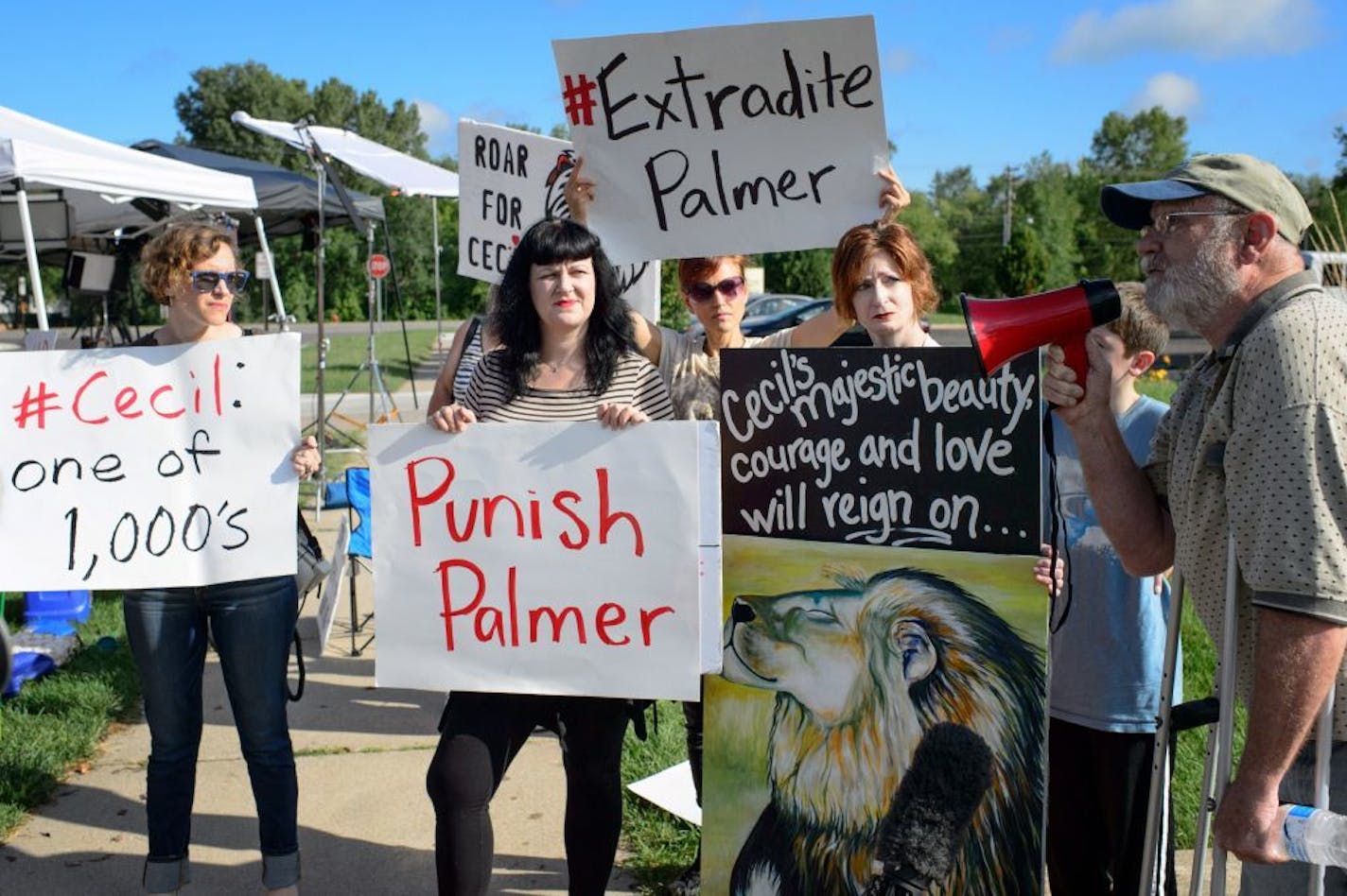 A small group of protesters gathered outside Dr. Walter Palmer's Bloomington office, which was protected by private security guards.