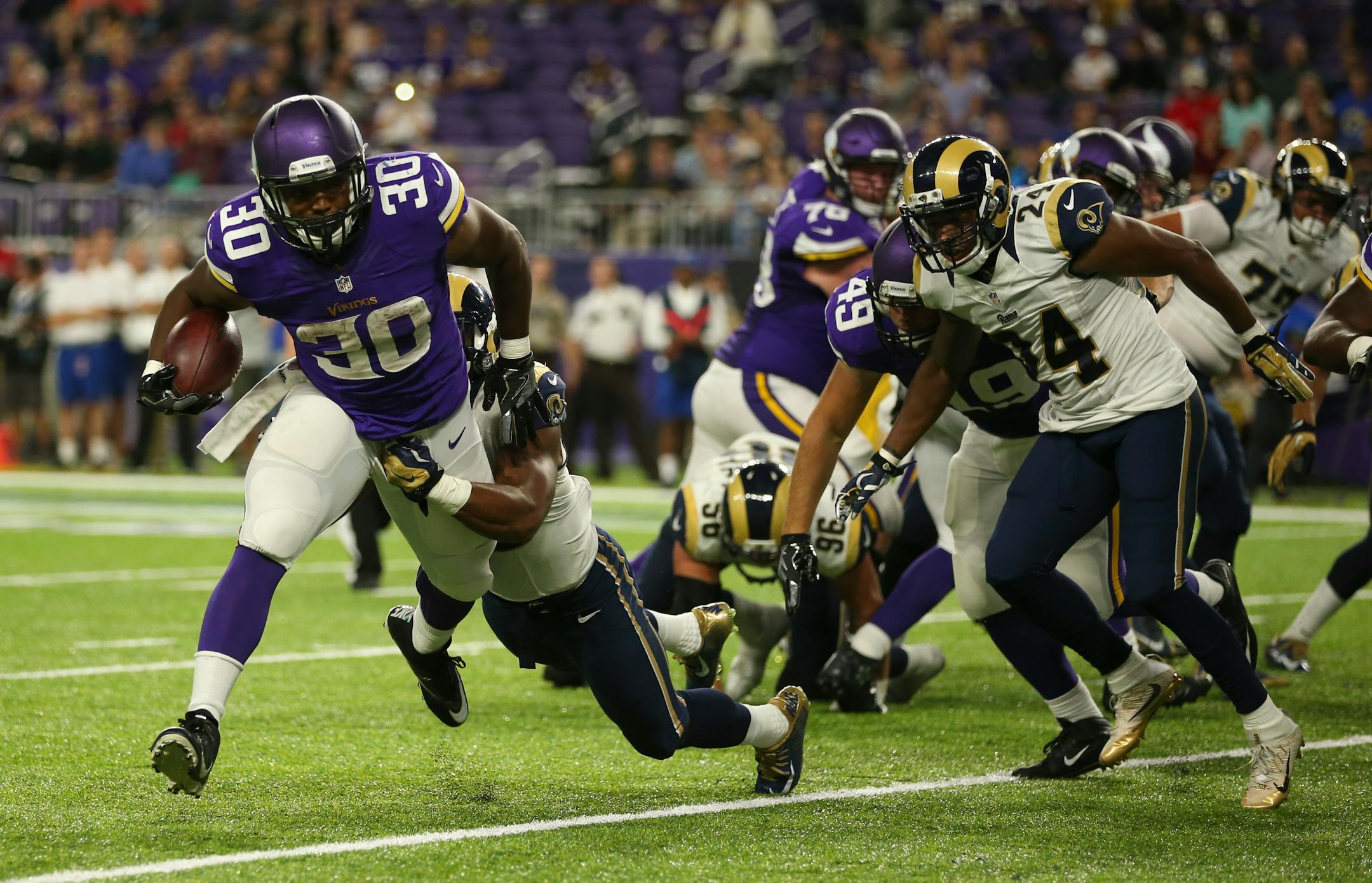 Vikings running back C.J. Ham (30), the Duluth native and Augustana graduate, was one of 10 players signed onto the Vikings practice squad.