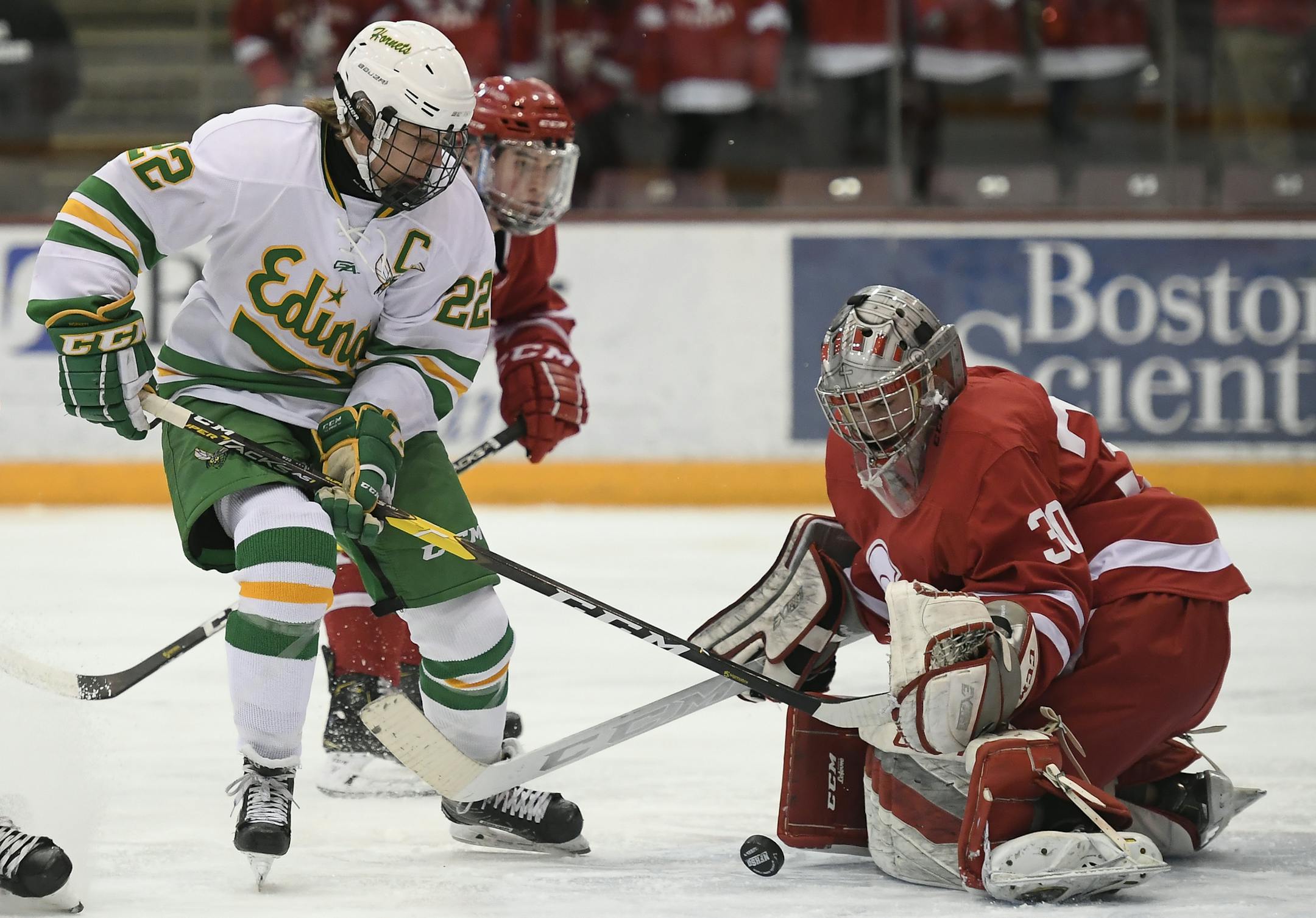Edina forward Jett Jungels (22) attempted to score against Benilde-St. Margaret's goaltender Carson Limesand (30) in the first period while being defended by defenseman Brady Yakesh (16) and forward Jett Johnson (5).. ] Aaron Lavinsky ¥ aaron.lavinsky@startribune.com Edina played Benilde-St. Margarets in the Class 2A, Section 6 boysÕ hockey section final on Wednesday, Feb. 27, 2019 at Mariucci Arena in Minneapolis, Minn.
