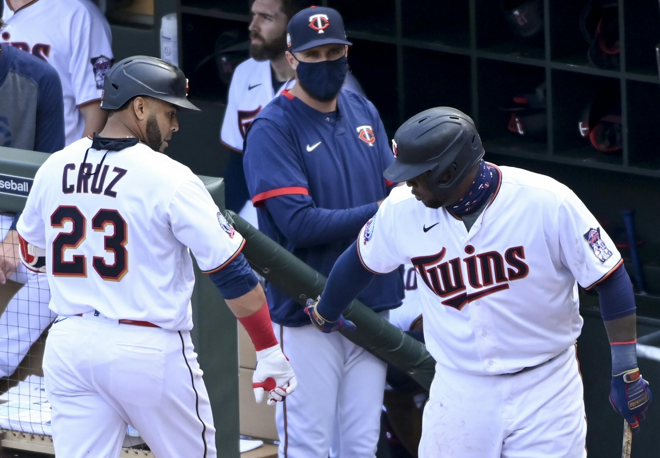 Minnesota Twins designated hitter Nelson Cruz (23) celebrated his solo home run with first baseman Miguel Sano (22) in the bottom of the fourth inning.