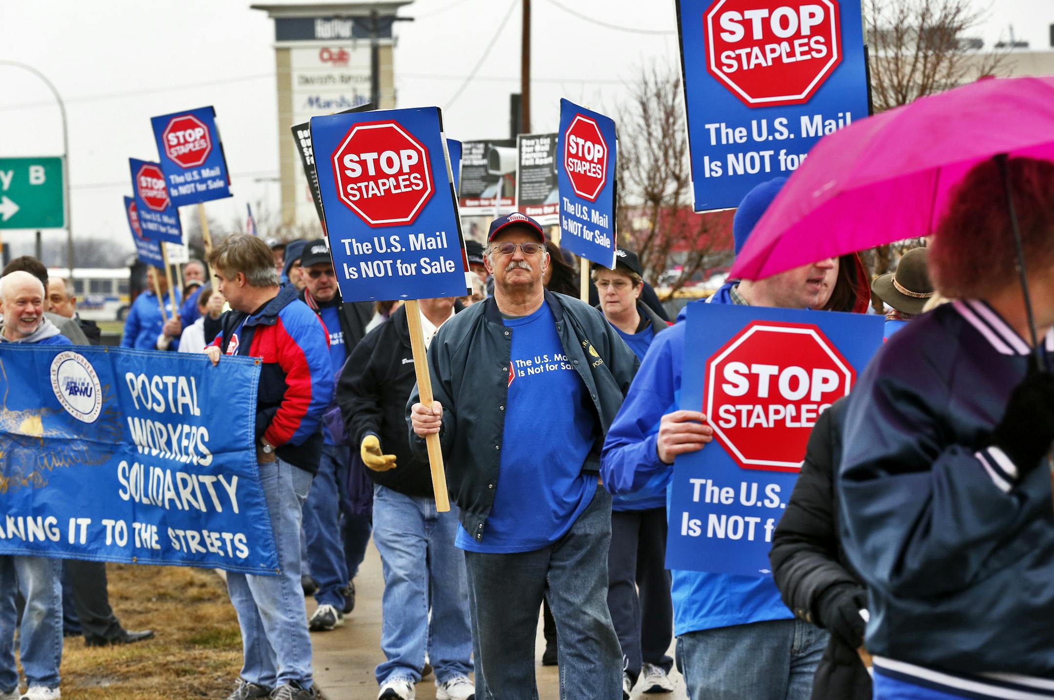 Postal workers gathered near Har Mar Mall in Roseville to protest the privatization of postal service and in particular the granting of Staples stores the right to provide postal services. ] (MARLIN LEVISON/STARTRIBUNE(mlevison@startribune.com)
