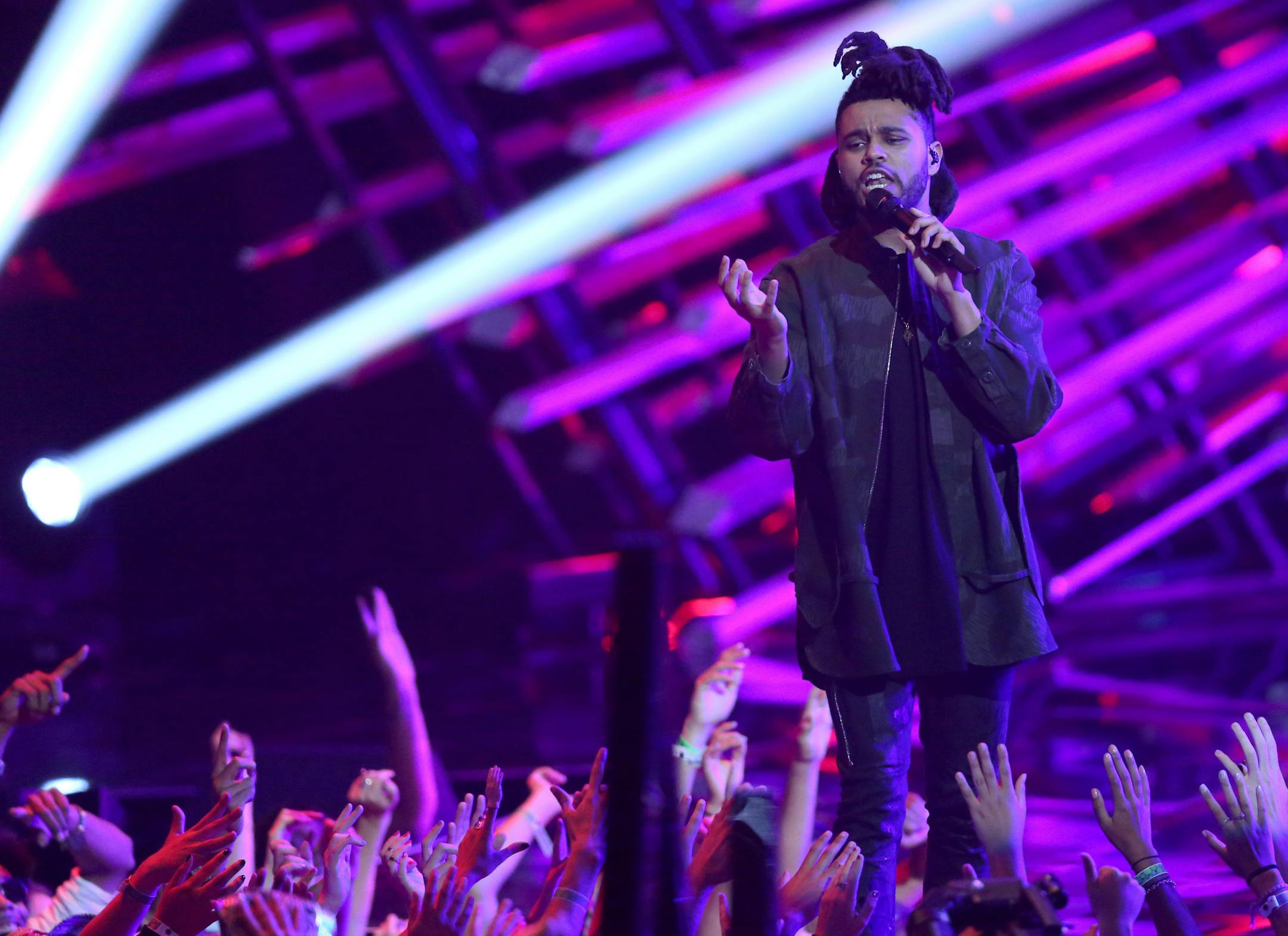 The Weeknd performs at the MTV Video Music Awards at the Microsoft Theater on Sunday, Aug. 30, 2015, in Los Angeles. (Photo by Matt Sayles/Invision/AP)