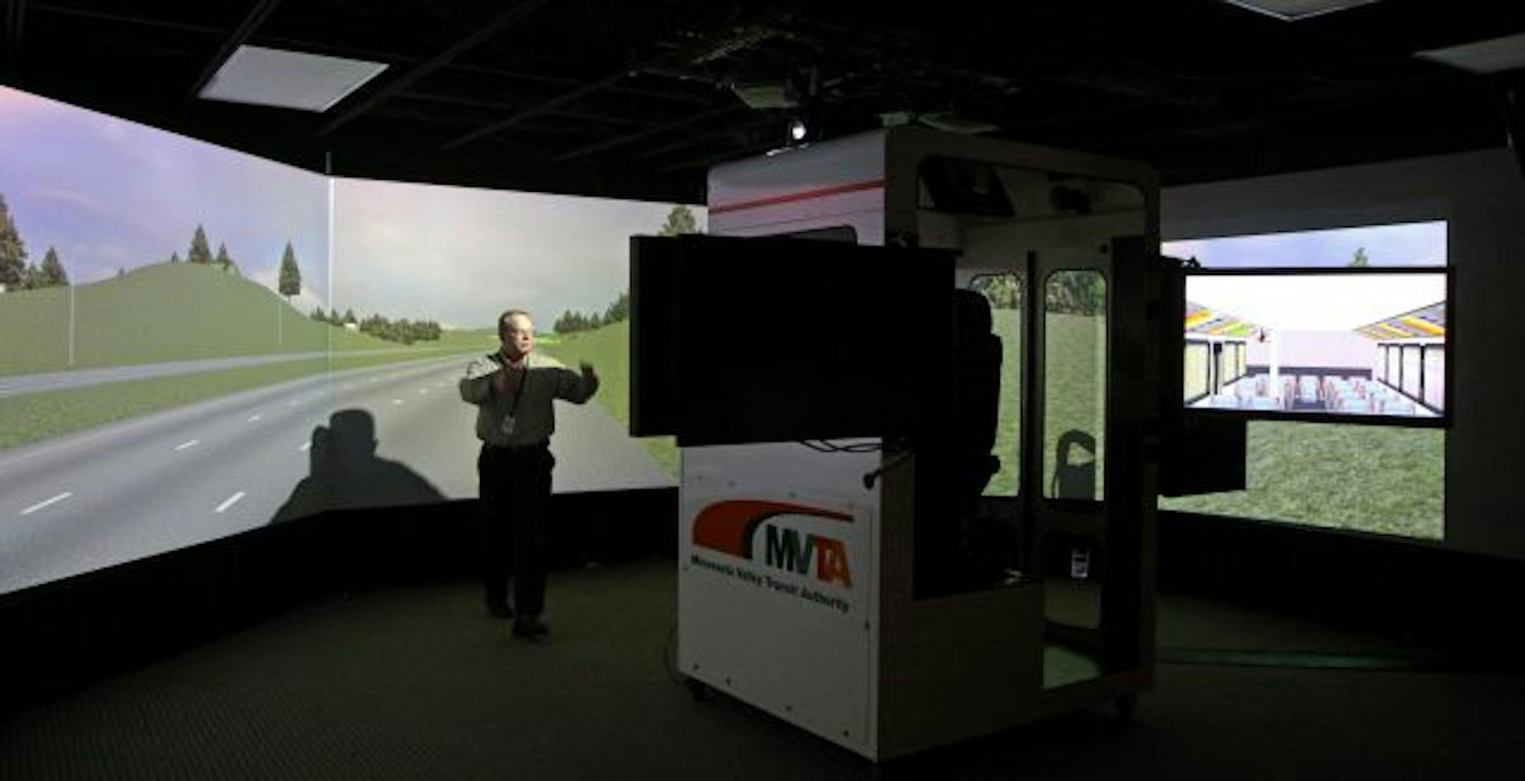 Michael Abegg, planning manager for the Minnesota Valley Transit Authority, showed off the high-tech simulator that includes a complete bus cab to train drivers how to use a new system meant to keep passengers rolling.