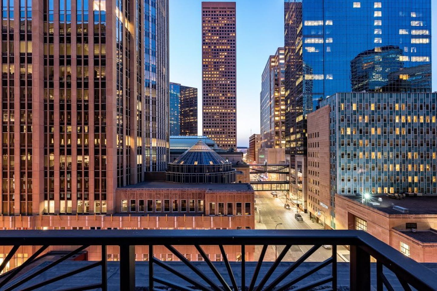 The Wells Fargo building, Westin Hotel and RBC Tower at sunset from the patio of the Six Quebec rooftop condo.