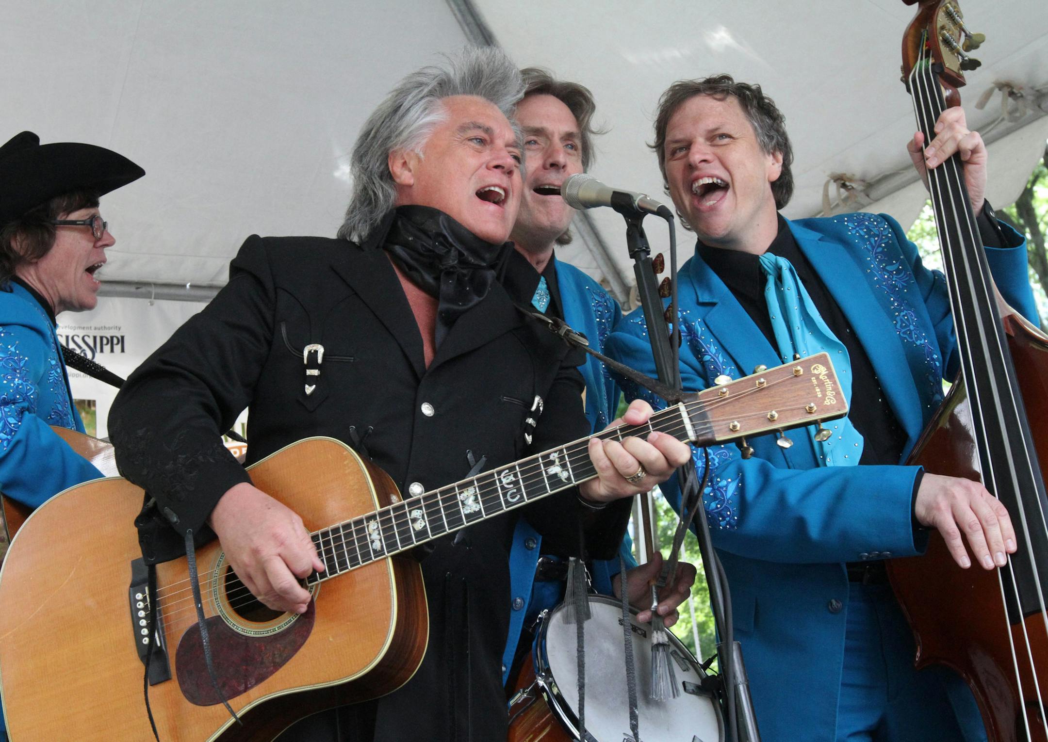 Marty Stuart, second from left, and His Fabulous Superlatives perform at the 35th Annual Mississippi Picnic in New York's Central Park Saturday, June 14, 2014. (AP Photo/Tina Fineberg)