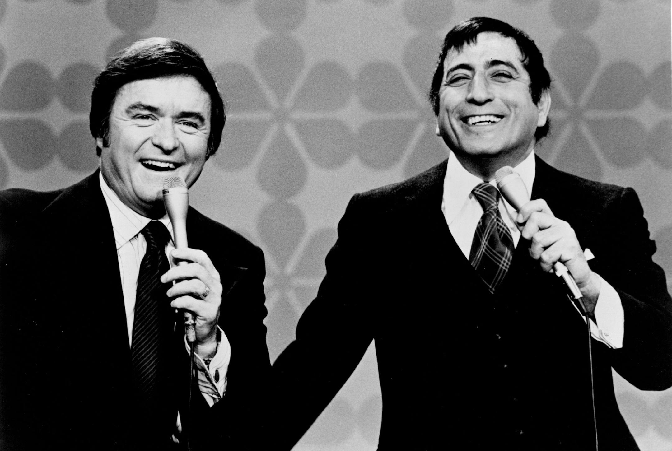 Mike Douglas and Tony Bennett generate great vibrations as they join musical forces on The Mike Douglas Show on Monday, Feb. 5, 1973. Also joining Mike and cohost Bennett are comedian Pat Cooper, Mike Curb, president of MGM Records, The New Seekers, and film critic Rex Reed.