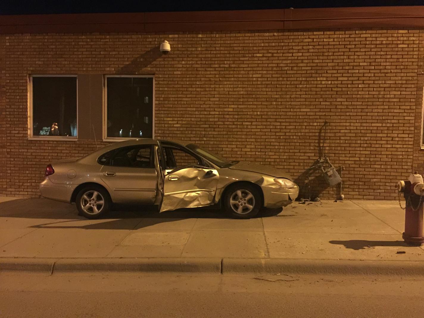 The driver died when he was ejected from his car as it went the wrong way on University Ave. SE in Minneapolis. The car came to a stop after hitting a gas meter.