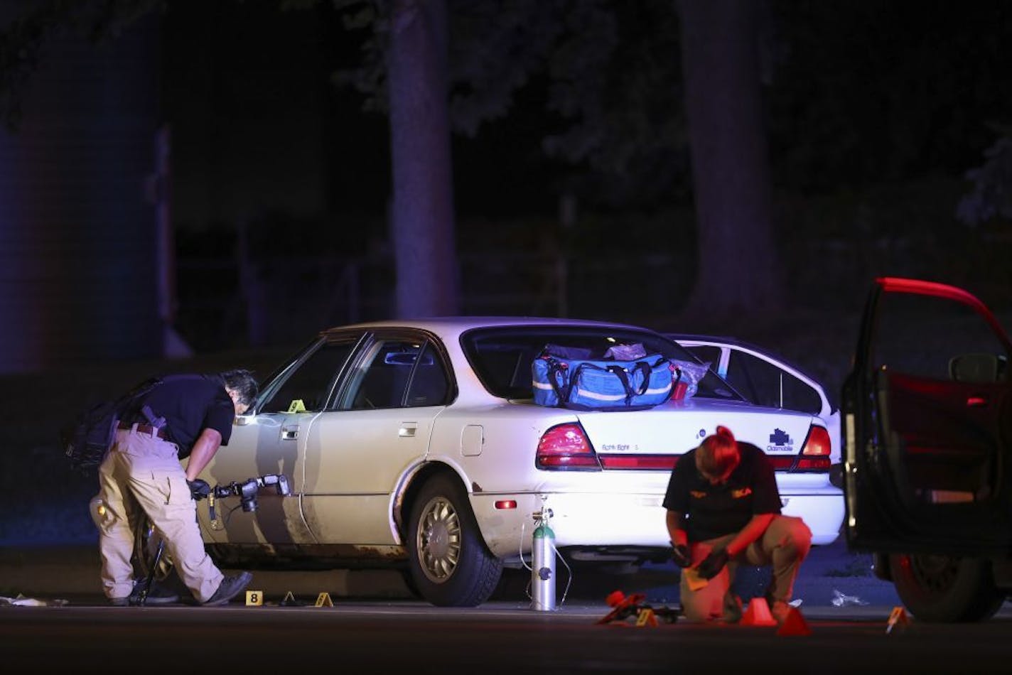 BCA investigators gathered evidence around the Oldsmobile being driven by Philando Castile when he was stopped by police and then shot Wednesday night.