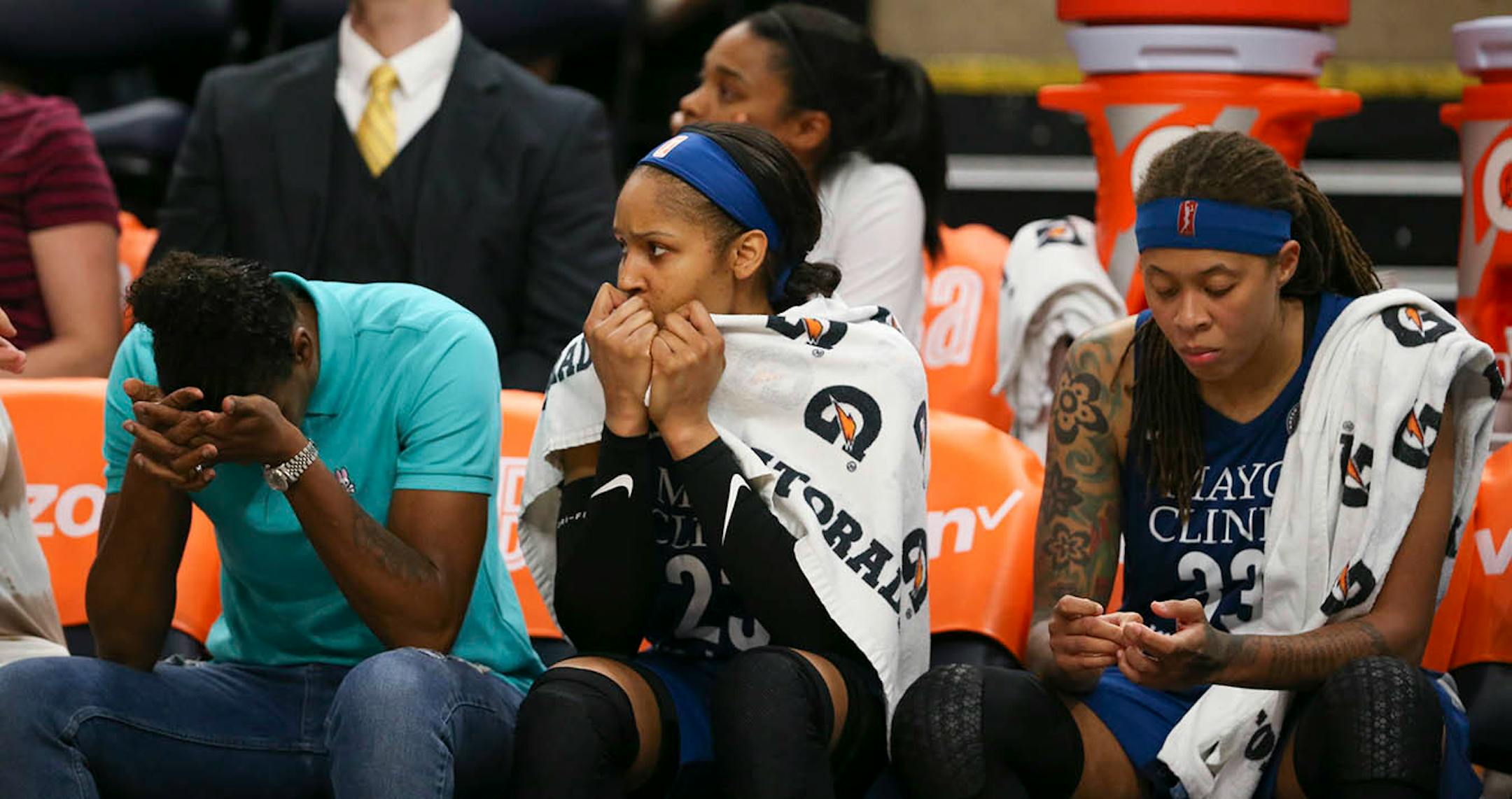 Injured Lynx forward Rebekkah Brunson, left, forward Maya Moore, and guard Seimone Augustus watched from the bench during the final minutes of the Lynx loss to the Sun. Moore and Augustus combined for just 11 points for the night.