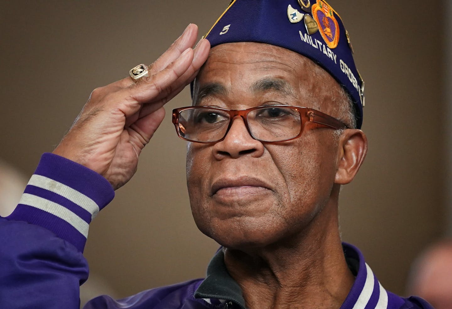 Vietnam War veteran Richard Jenkins rose and saluted when the 34th Infantry Division Red Bull Band played the Army Anthem during the Veterans Day event in Inver Grove Heights on Monday.