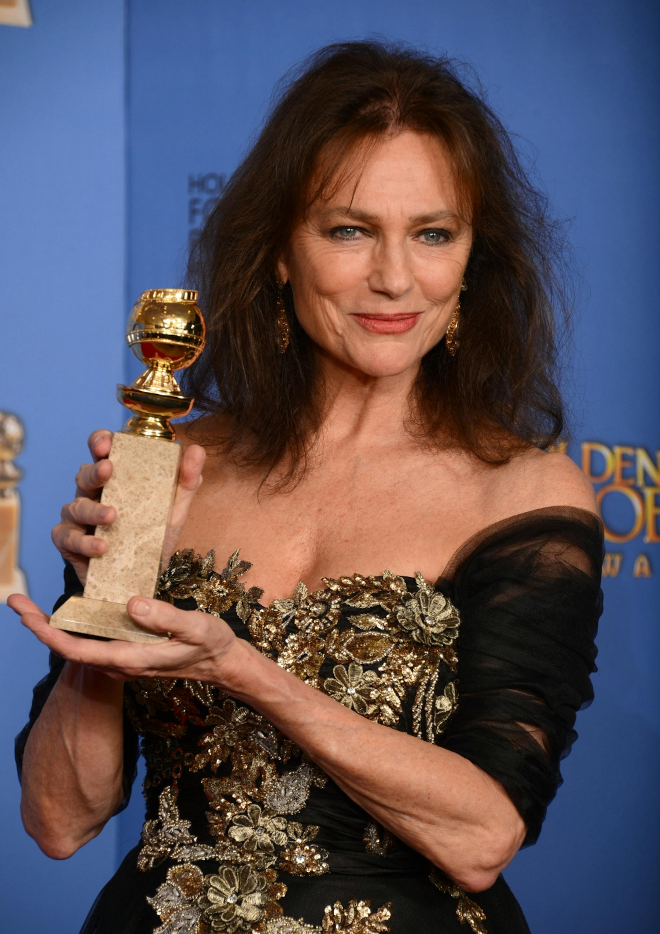 Jacqueline Bisset poses in the press room with the award for best supporting actress in a series, mini-series or motion picture made for television for "Dancing on the Edge" at the 71st annual Golden Globe Awards at the Beverly Hilton Hotel on Sunday, Jan. 12, 2014, in Beverly Hills, Calif.