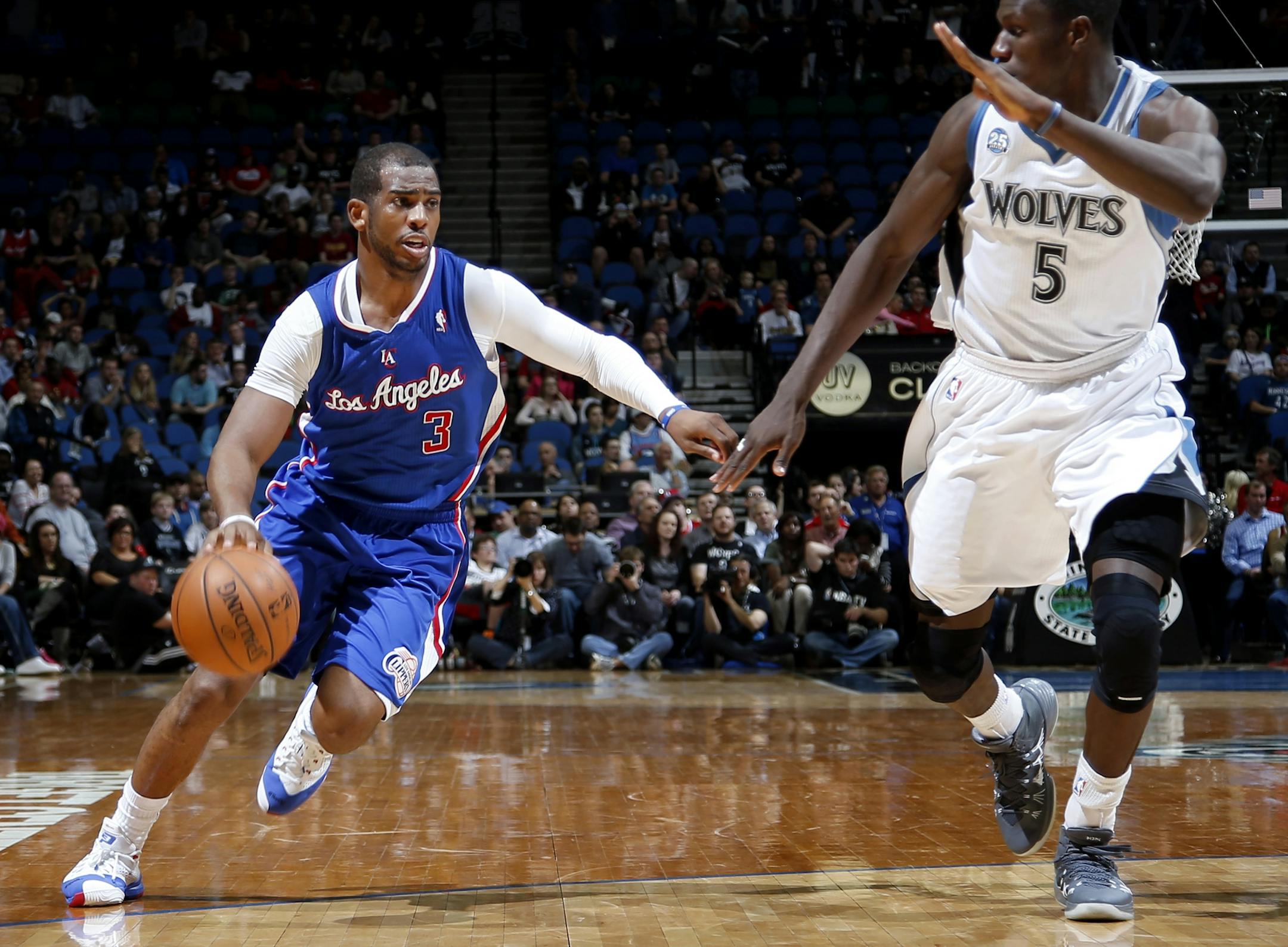 Clippers guard Chris Paul (3) attempted to drive past Gorgui Dieng (5) in the fourth quarter. Los Angeles beat Minnesota by a final score of 114-104.