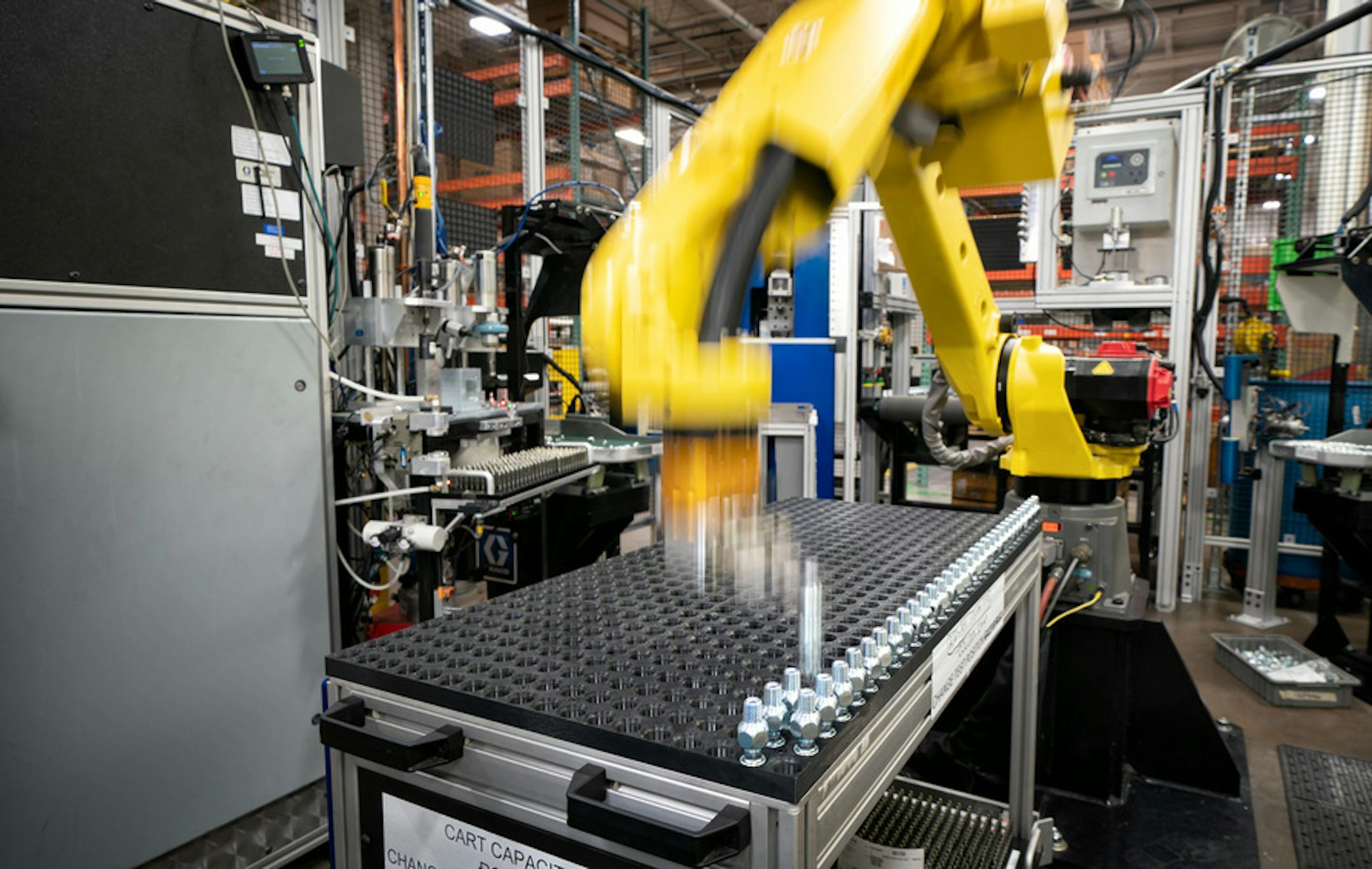 A robot at Graco assembles air hose needle valves at Graco. ] GLEN STUBBE &#x2022; glen.stubbe@startribune.com Thursday, February 14, 2019 Graco, Dunwoody College & Fanuc team up to teach people to completely automate assembly lines with new robots. Graco added 24 robots in last few years. Two more robots arrive in two weeks. The robots (xome $1 million) are the answer to a hiring shortage that has caused product delays to customers. Need pix of Randy Barcus & employees w/ robotic manufacturing
