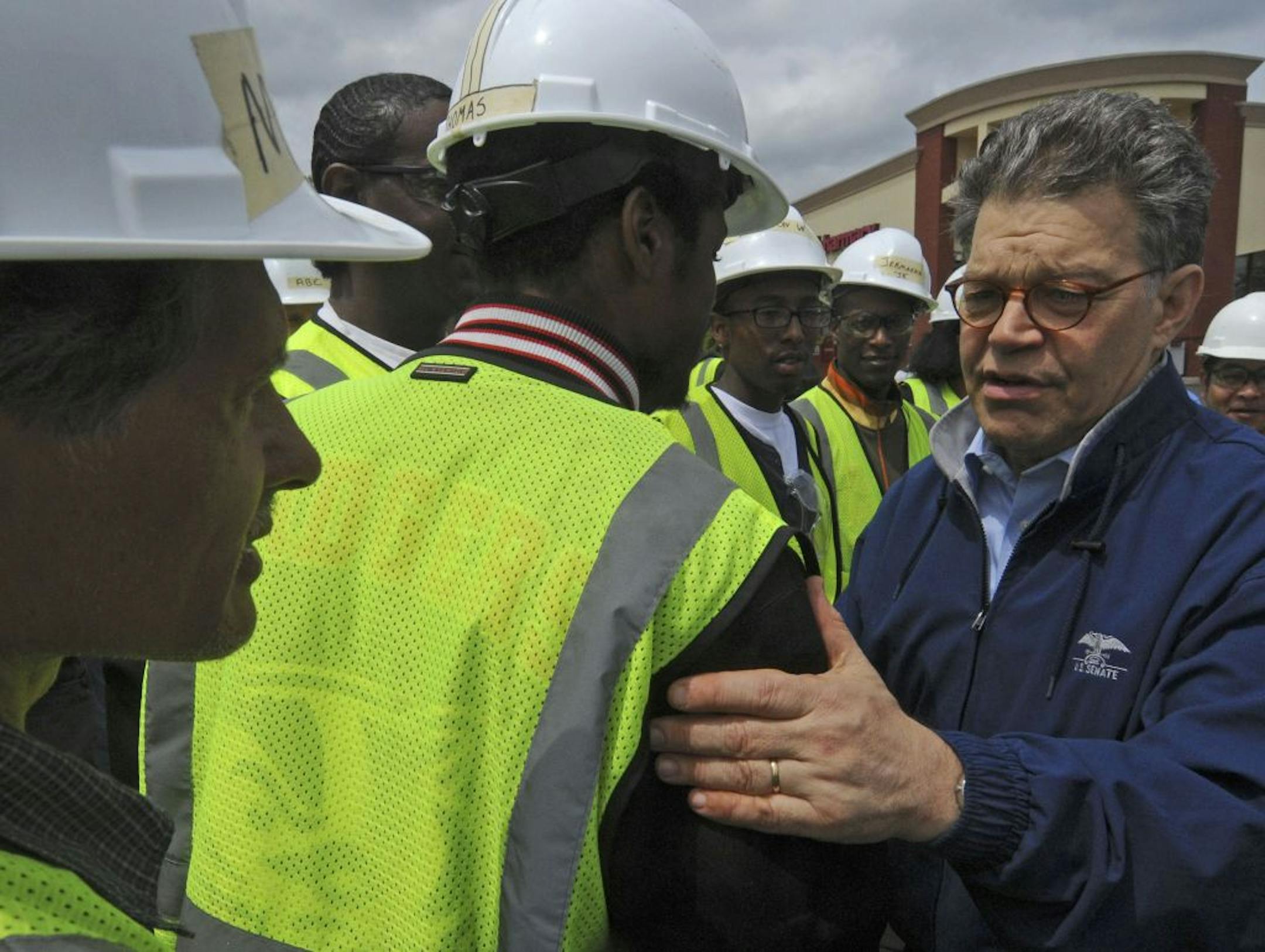 Students from Summit Academy in Minneapolis have been volunteering helping out with storm recovery over the last week. Minnesota Sen., Al Franken greeted about thirty of the students at 26th Ave N and Broadway in North Minneapolis, Minn. on Friday, May 27th.