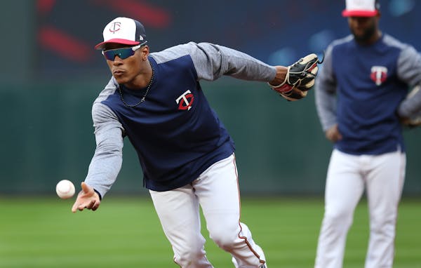 Twins shortstop Jorge Polanco tossed the ball to first base during Sunday's practice at Target Field, preparing for Monday's Opening Day game against 