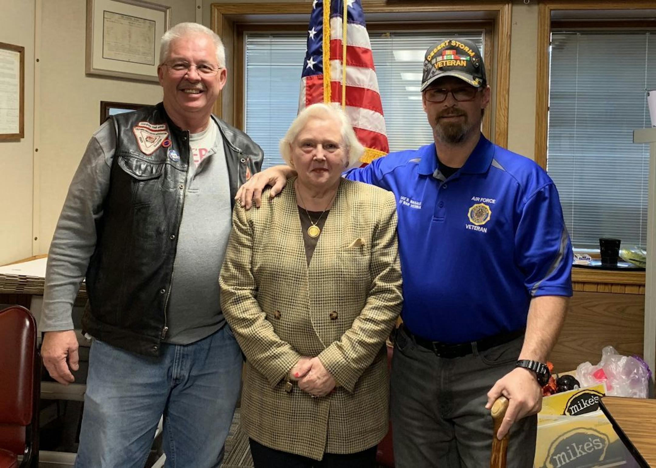 Baker Hiltrud Steimel teamed up with Chaska American Legion Post #57 to send hundreds of cakes to the troops this December. She met with Post Commander Steven NaSalle, right, and Jim Zangl, left, this week.