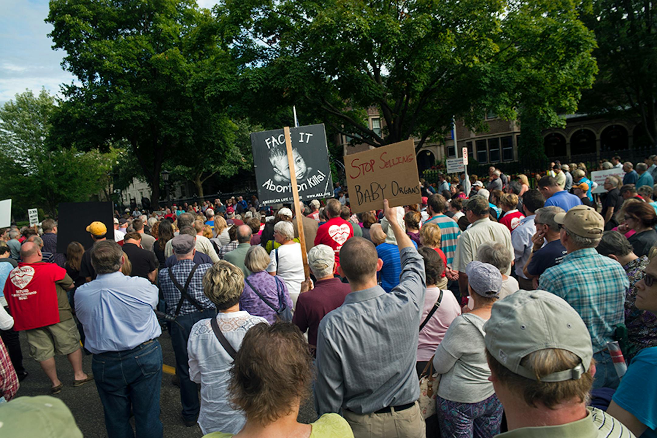 In front of the governor's mansion in St. Paul, pro-life activists gathered to ask Gov. Mark Dayton to investigate Planned Parenthood and calling for legislators to defund the organization. Brian Gibson, executive director of Pro-Life Action Ministries was leading the crowd of over 500.