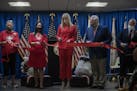 Ivanka Trump, center, cut the ribbon at the grand opening of the first Missing and Murdered Native American Cold Case Office. American Indians and Ala