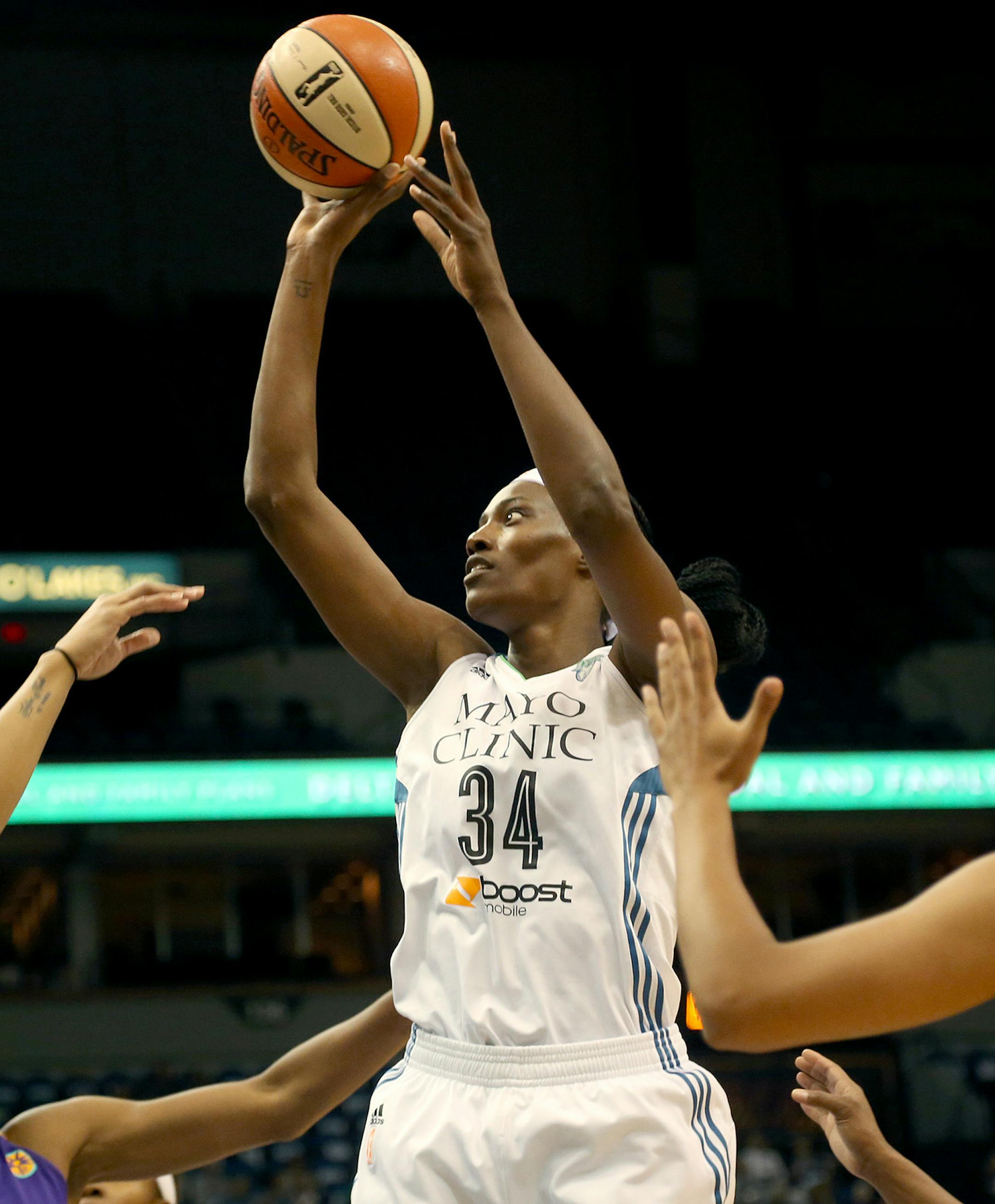 Lynx Sylvia Fowles went up a her shot surround by Sparks players during the first quarter. ] (KYNDELL HARKNESS/STAR TRIBUNE) kyndell.harkness@startribune.com Lynx vs LA Sparks during the first round of the WNBA Playoffs at Target Center in Minneapolis Min., Friday September 18, 2015.