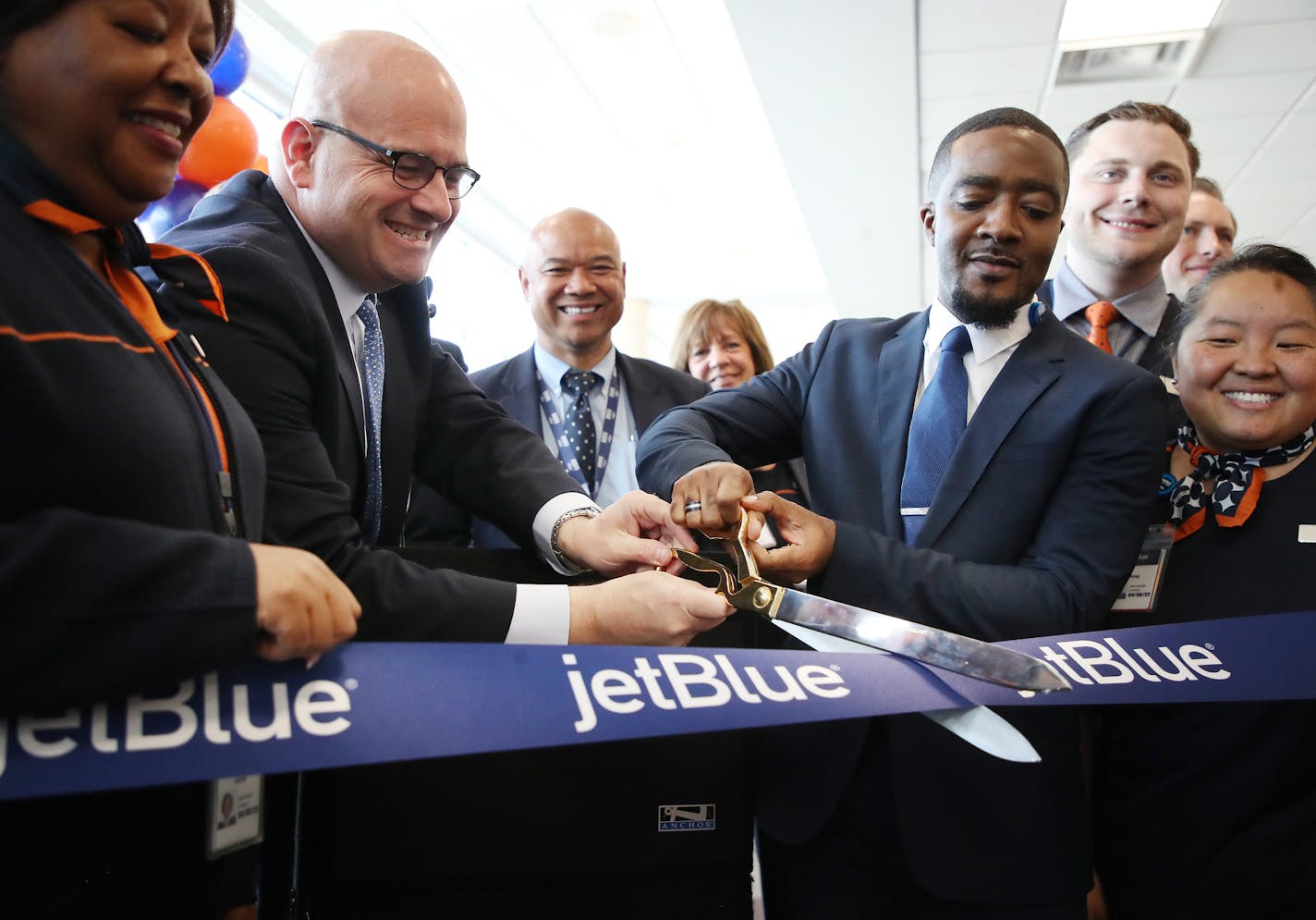 Marty St. George - executive Vice President of commercial and planning left and Gladstone Adderley General Manager cut a ribbon for the start of JetBlue service at MSP Thursday May 3, 2018 Bloomington, MN. ] JERRY HOLT &#xef; jerry.holt@startribune.com