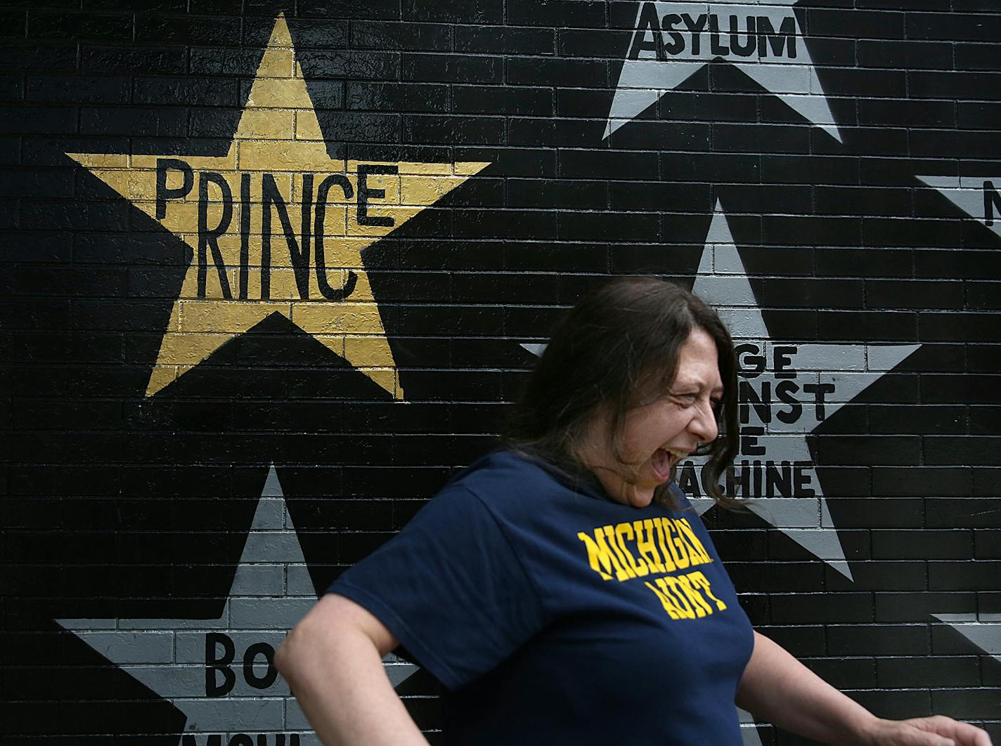 Laura Menard enjoyed the visit to First Avenue where Prince&#xed;s star is among many painted on an outside wall. ] JIM GEHRZ &#xef; james.gehrz@startribune.com / Waconia, MN / May 28, 2016 8:30 AM &#xf1; BACKGROUND INFORMATION: Waconiaville Tours kicks off a new tour of Prince's Minneapolis, with stops at First Avenue, the Capri, the house from Purple Rain, his junior high school, Electric Fetus and Paisley Park. Prince Tour of Minneapolis, leaves from Waconia. ORG XMIT: MIN1605311308021491