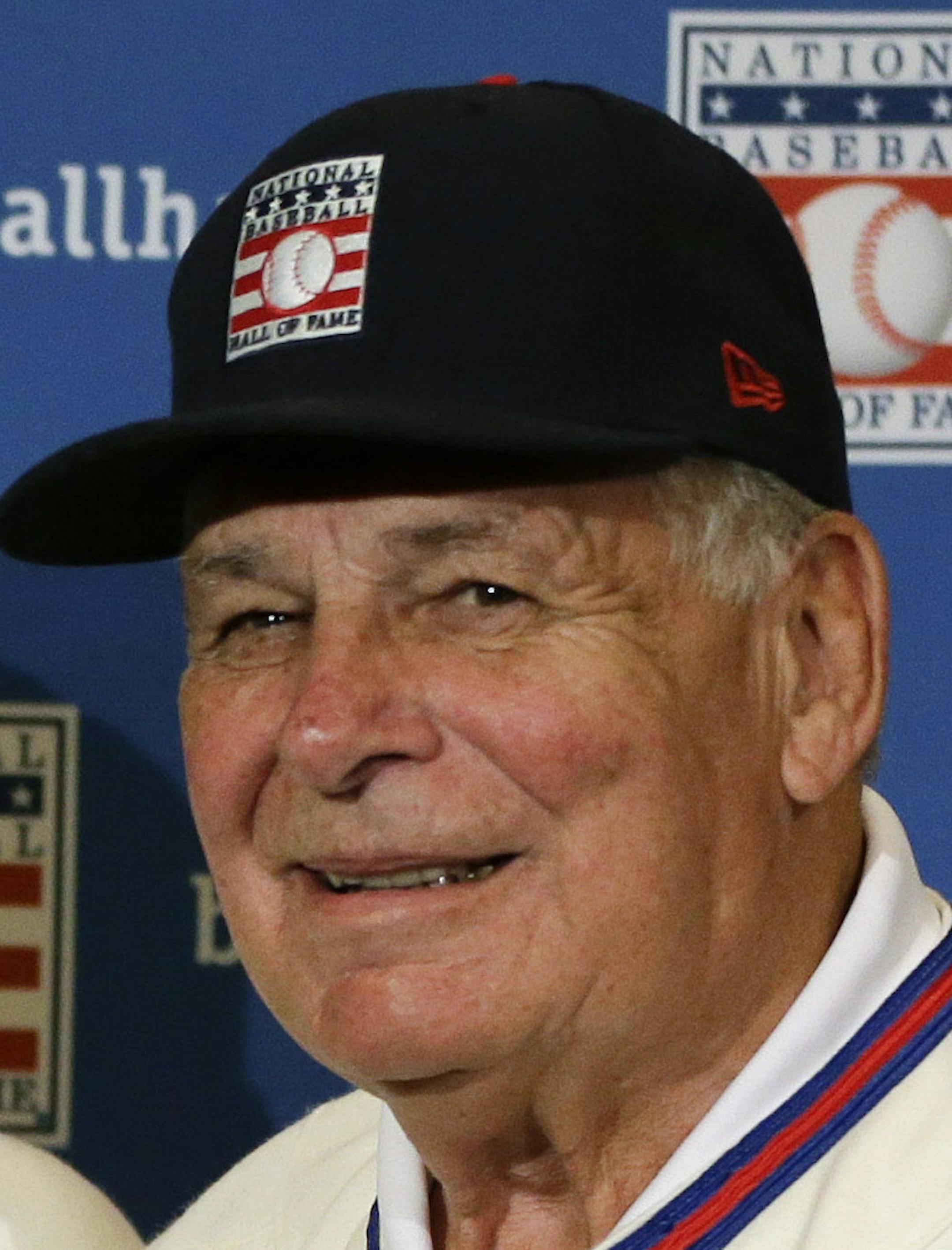 ADVANCE FOR WEEKEND EDITIONS, JULY 26-27 - FILE - In this Dec. 9, 2013 file photo, retired managers, from left, Tony La Russa, Joe Torre and Bobby Cox gather for a photo after it was announced that they were unanimously elected to the Baseball Hall of Fame, at a news conference during MLB winter meetings in Lake Buena Vista, Fla. Induction ceremonies are Sunday, July 27, 2014, in Cooperstown, N.Y. (AP Photo/John Raoux, File)