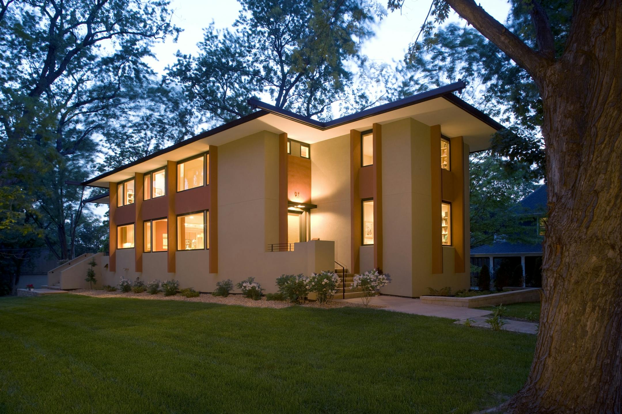 Home of the Month Architect Kelly Davis' modern interpretation of Prairie style uses brick-red fins to give the stucco facade rhythm and color.