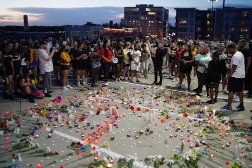 Mourners listened as friends and family spoke about Winston Smith at a candlelight vigil for Smith on top of the parking ramp where he was killed the day before by police in Minneapolis, Minn., on June 4, 2021. ] RENEE JONES SCHNEIDER • renee.jones@startribune.com ORG XMIT: MIN2106042157191124