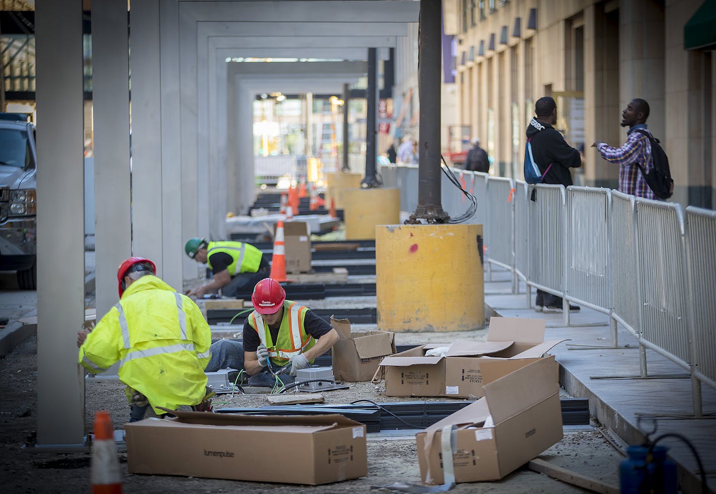 Construction work continued along Nicollet Mall, Tuesday, August 22, 2017 in downtown Minneapolis, MN. The reconstruction project is going to cost $2.1 million more than expected, after crews worked extra hours this winter, utility designs changed and additional mulch was brought in for the downtown Minneapolis project. ] ELIZABETH FLORES &#xef; liz.flores@startribune.com