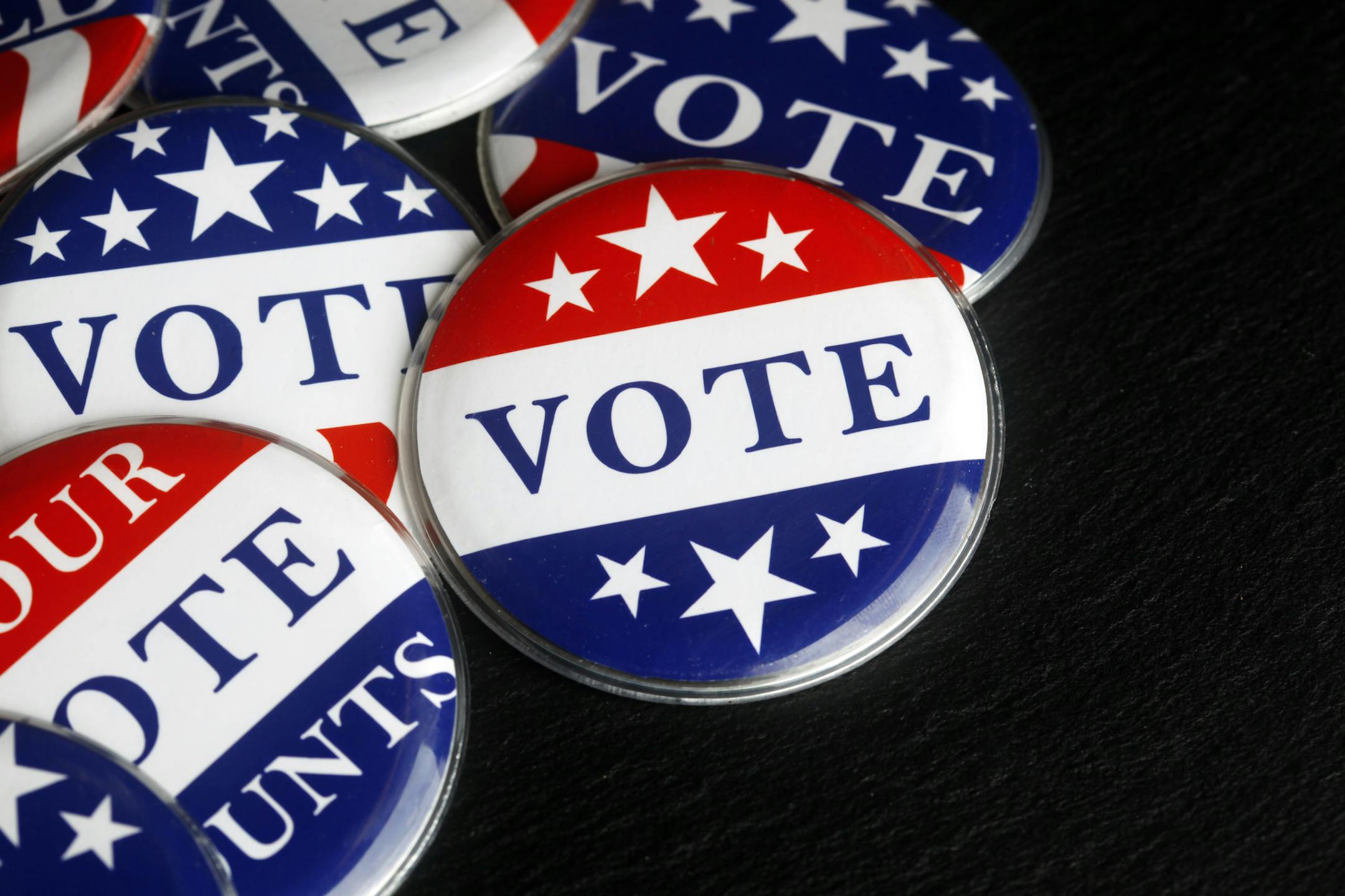 iStock
Red, white, and blue vote buttons.