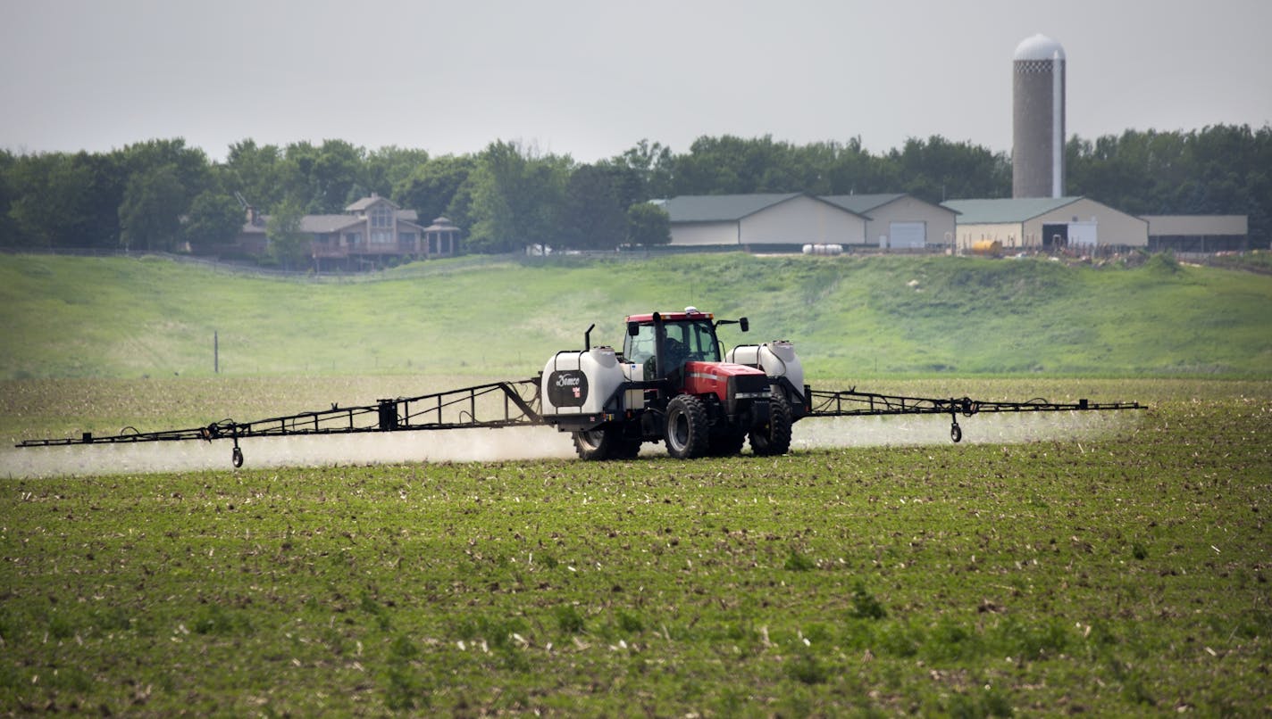 Farmers apply fertilizer to their fields south of Edgerton.