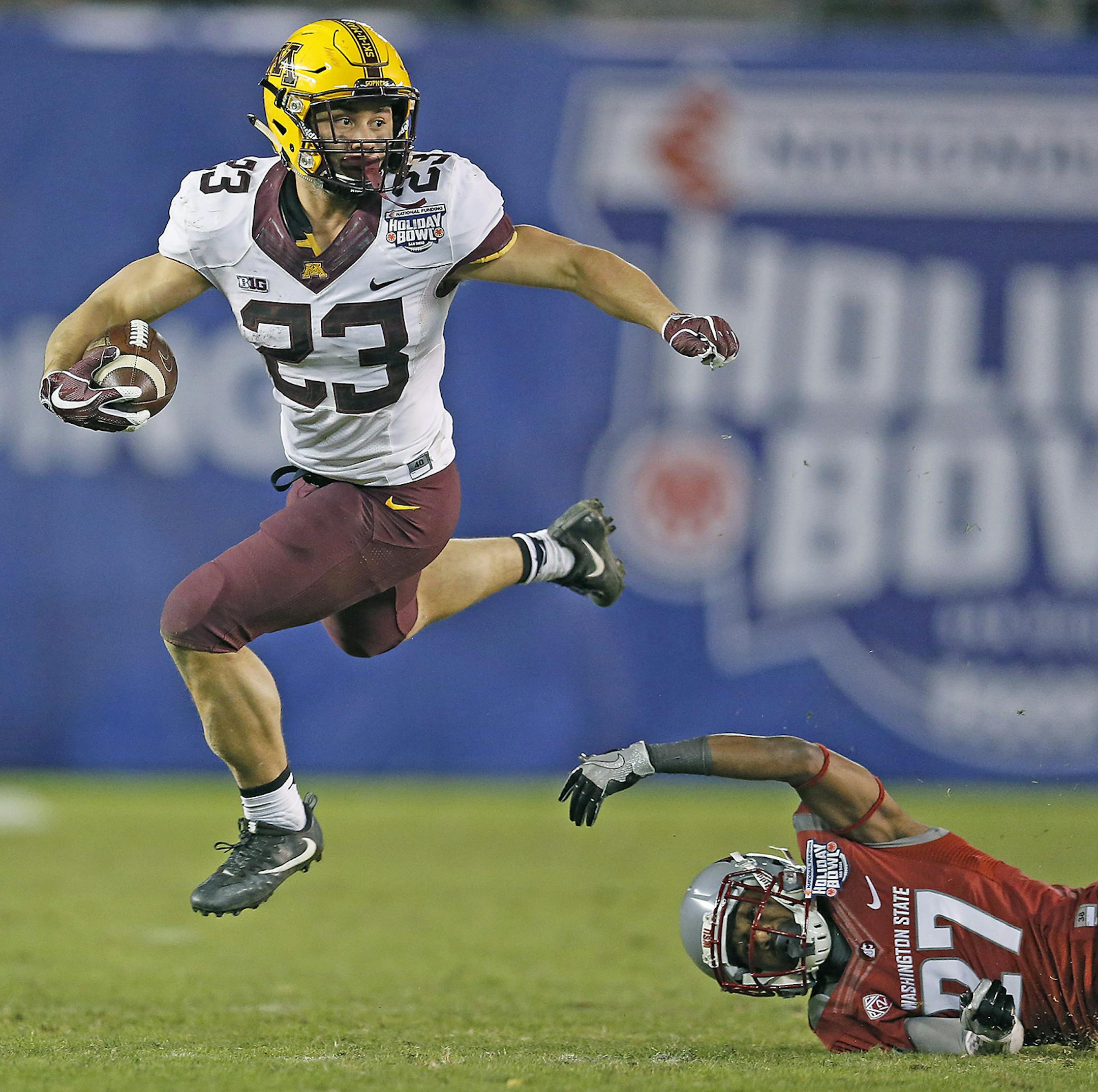 Minnesota's running back Shannon Brooks ran over Washington State's cornerback Marcellus Pippins during the fourth quarter as they took on Washington State at Qualcomm Stadium for the San Diego Holiday Bowl, Tuesday, December 27, 2016 in San Diego, CA. ] (ELIZABETH FLORES/STAR TRIBUNE) ELIZABETH FLORES &#x2022; eflores@startribune.com