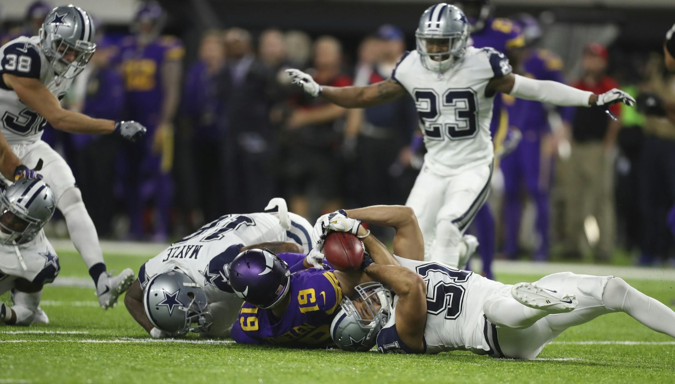 Dallas Cowboys outside linebacker Kyle Wilber (51) ended up with the ball after Vikings wide receiver Adam Thielen (19) lost control of it while fielding a punt in the fourth quarter. Dallas challenged the ruling on the field and scored on the next play.