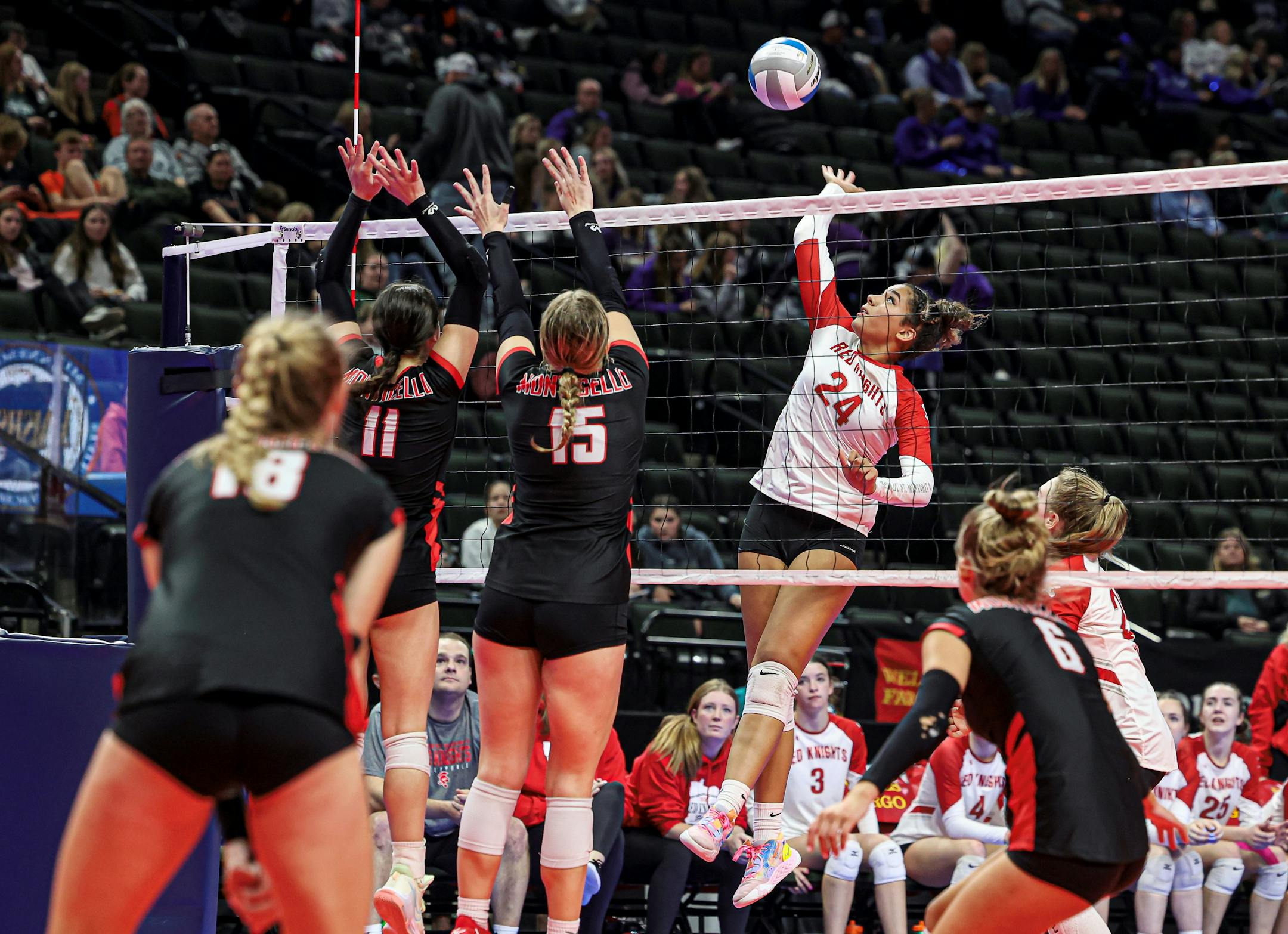 Benilde-St. Margaret's Sierre Lumpkin (24) went up on the attack in the fifth set of the Red Knights' 3-2 victory at the Xcel Energy Center on Wednesday, Nov. 9, 2022. Class 3A state volleyball quarterfinals, Benilde-St. Margaret's vs. Monticello, 11-9-22. Photo by Mark Hvidsten, SportsEngine