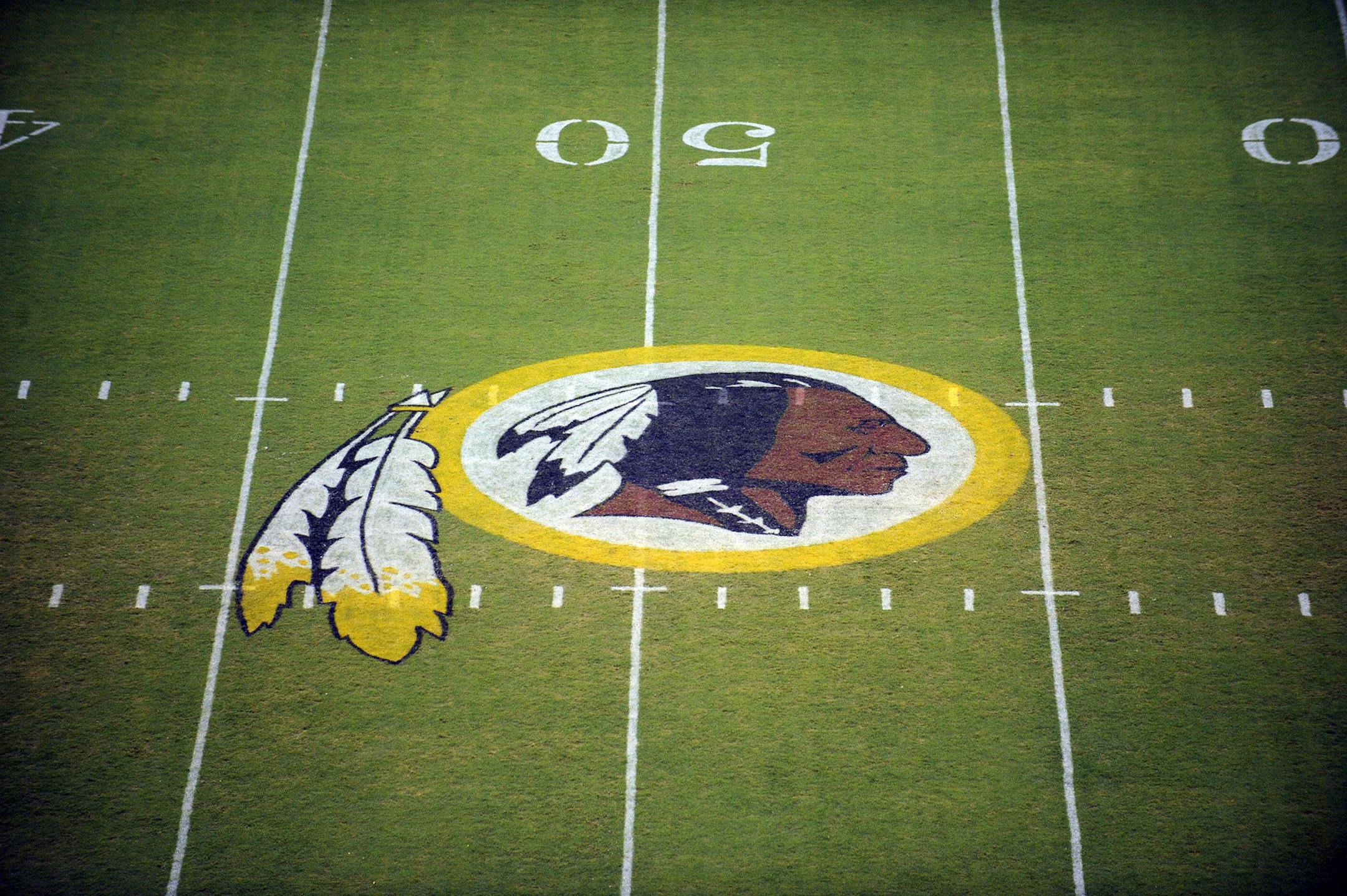 The Washington Redskins logo is shown on the field before the start of a preseason NFL football game against the New England Patriots, Friday, Aug. 28, 2009, in Landover, Md. (AP Photo/Nick Wass) ORG XMIT: NYOTK