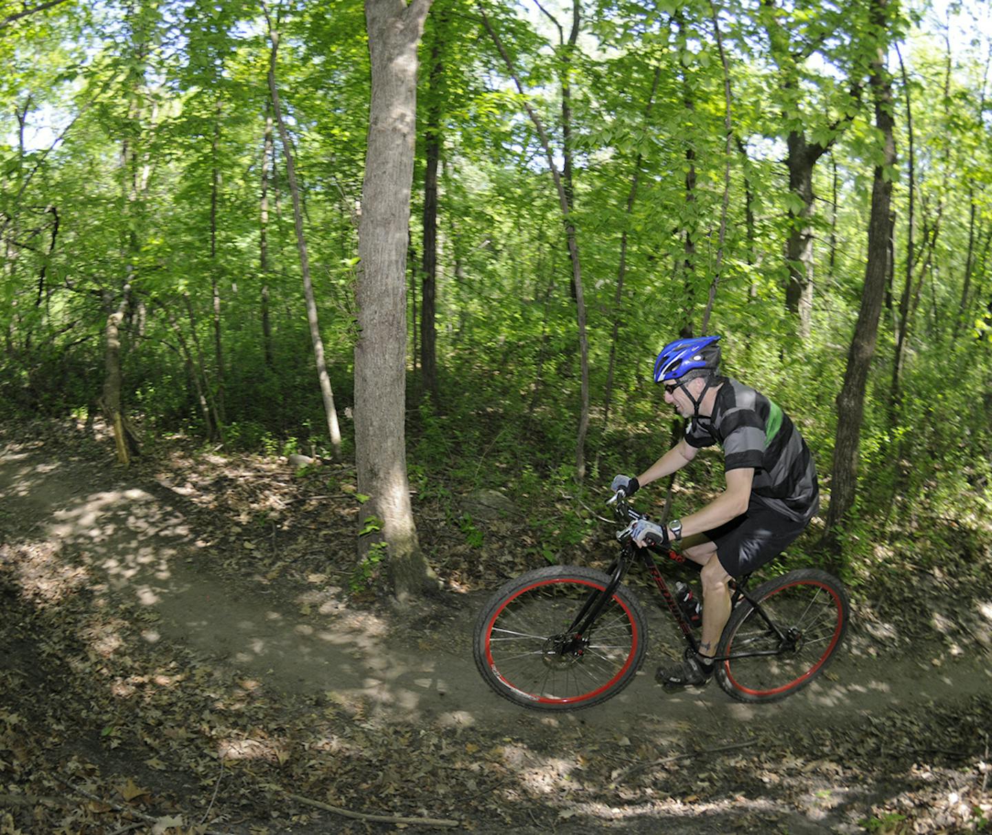 Mountain bike riding at Elm Creek Park Reserve, for Outdoors Weekend.